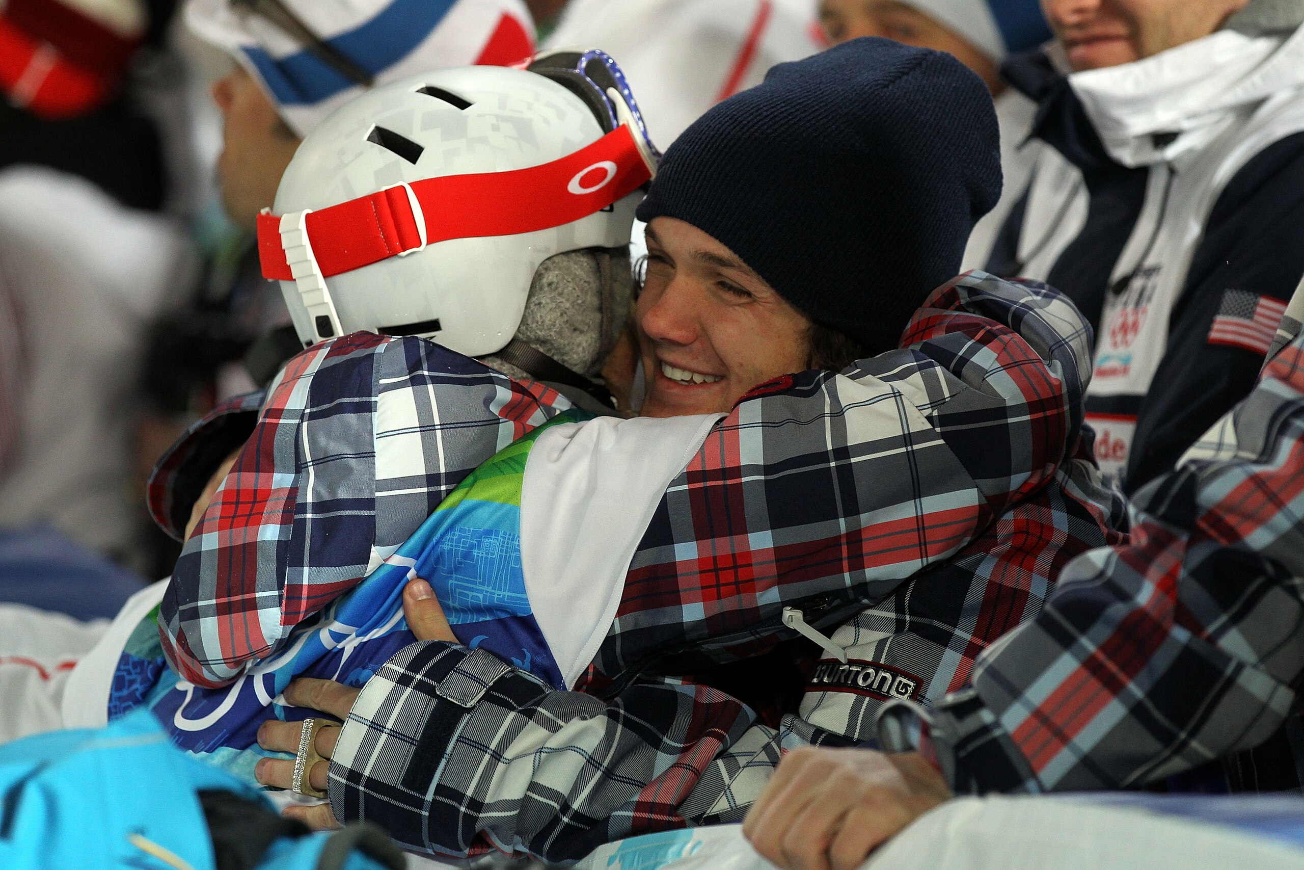 VANCOUVER, BC - FEBRUARY 18: Team USA Men's snowboard team member Louie Vito consoles Gretchen Bleiler of the United States during the women's snowboard halfpipe final on day seven of the Vancouver 2010 Winter Olympics at Cypress Snowboard & Ski-Cross Sta