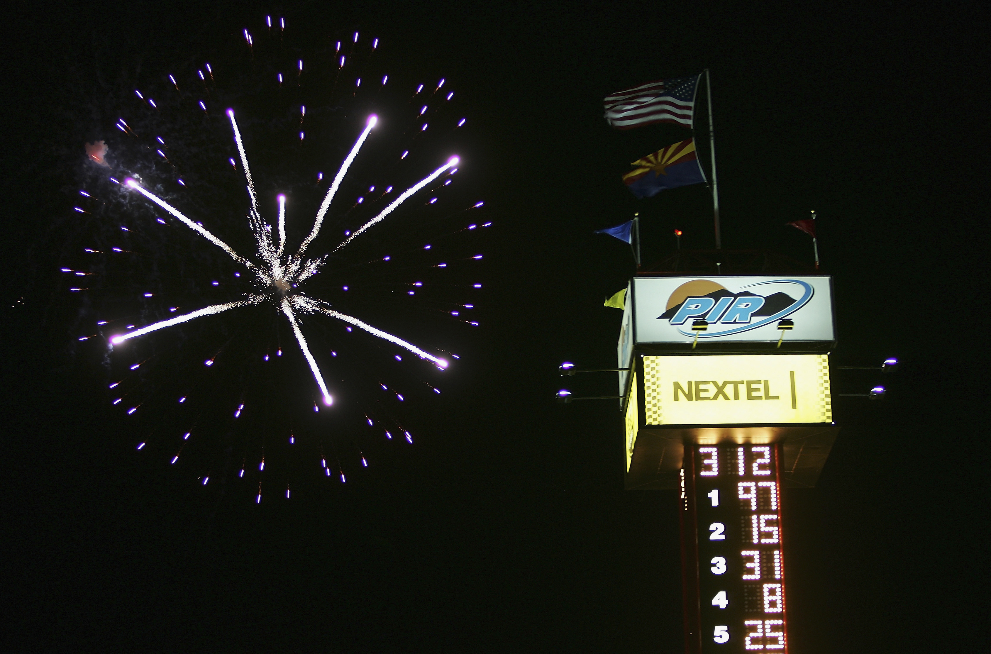 PHOENIX,  AZ - APRIL 23: Fireworks light up the sky as the scoring tower shows the race results after Kurt Busch driver of the #97 Roush Racing Irwin Industrial Tools Ford won the NASCAR Nextel Cup Series Subway Fresh 500 at the Phoenix International Race