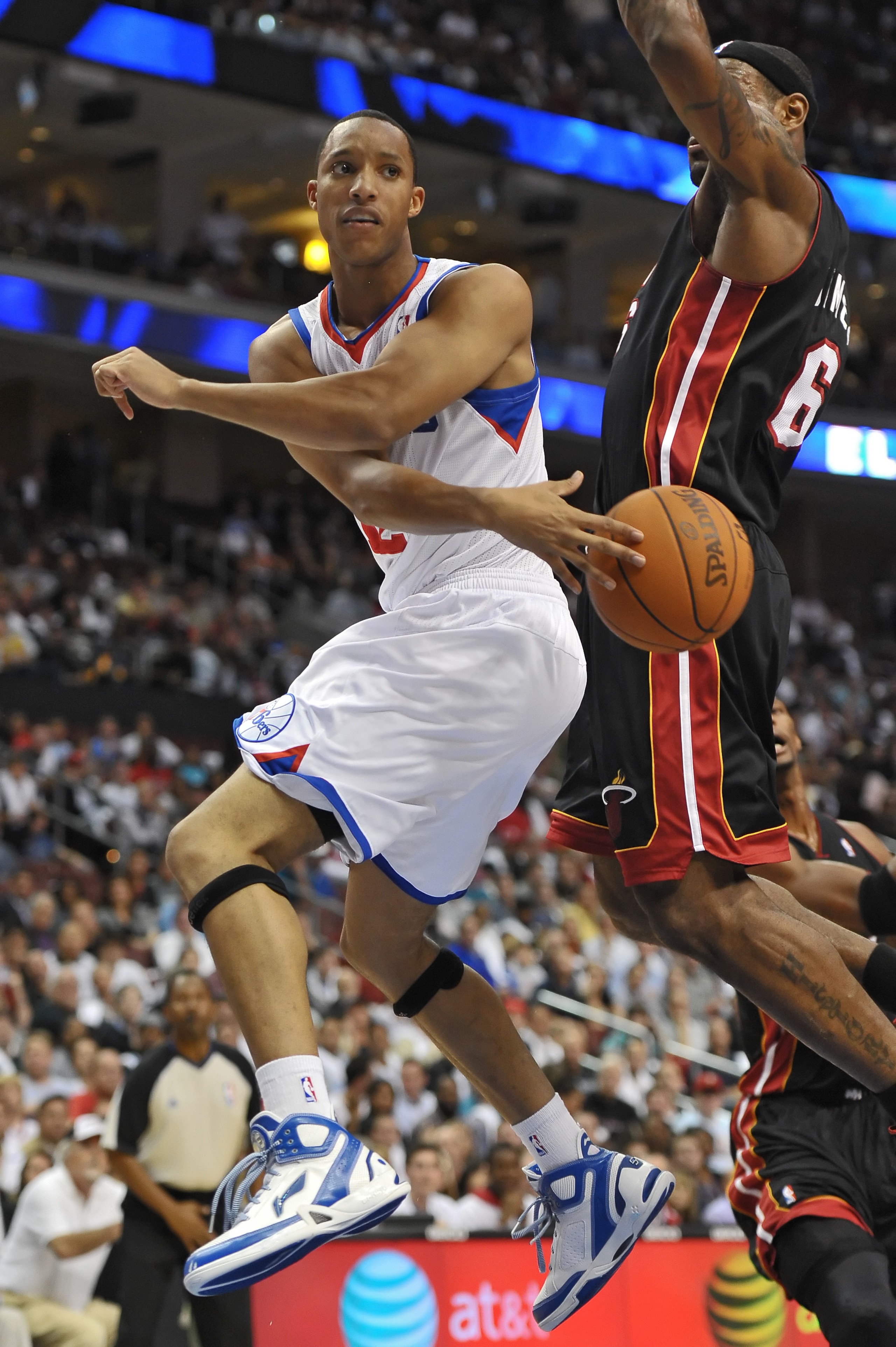 PHILADELPHIA - OCTOBER 27:  Evan Turner #12 of the Philadelphia 76ers passes the ball around LeBron James #6 of the Miami Heat at the Wells Fargo Center on October 27, 2010 in Philadelphia, Pennsylvania. NOTE TO USER: User expressly acknowledges and agree