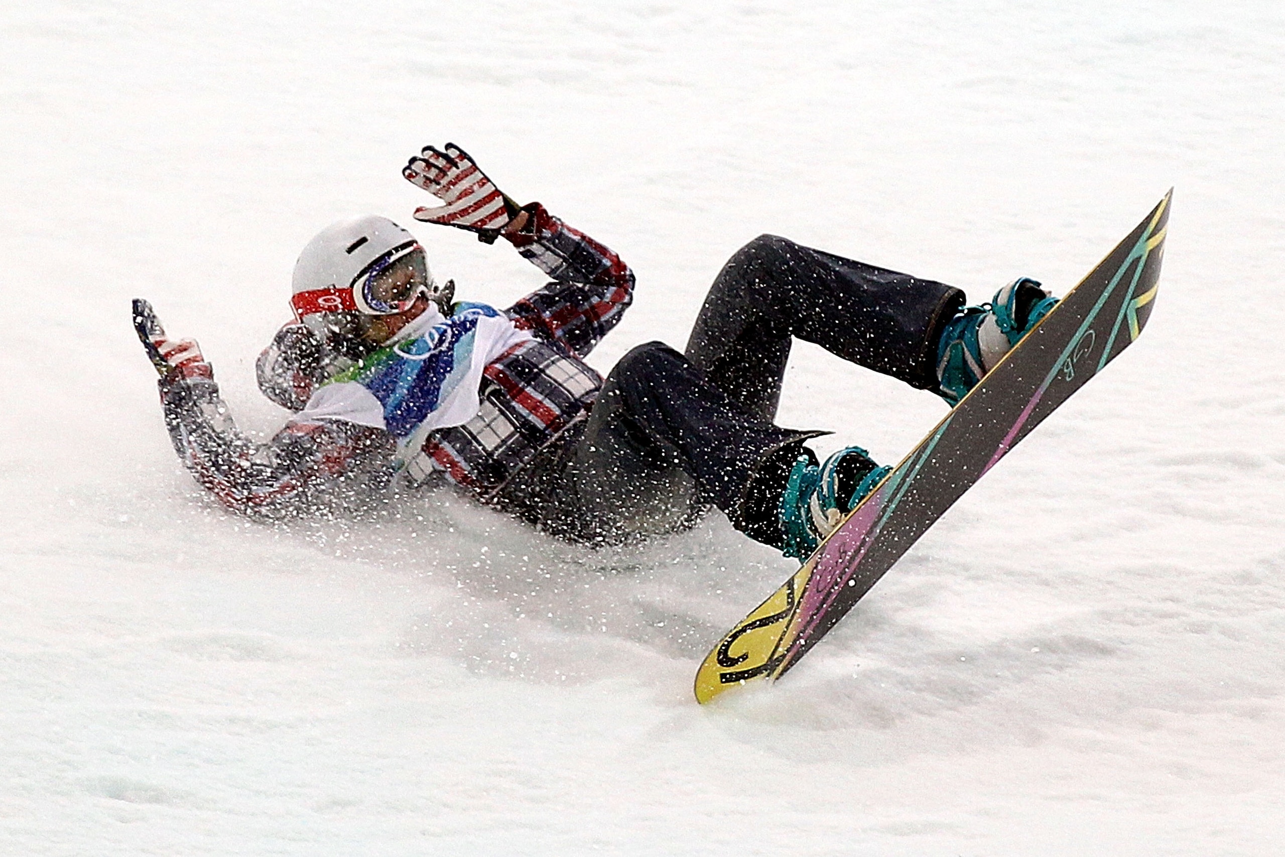 VANCOUVER, BC - FEBRUARY 18:  Gretchen Bleiler of the United States crashes on her second run during the the women's snowboard halfpipe final on day seven of the Vancouver 2010 Winter Olympics at Cypress Snowboard & Ski-Cross Stadium on February 18, 2010