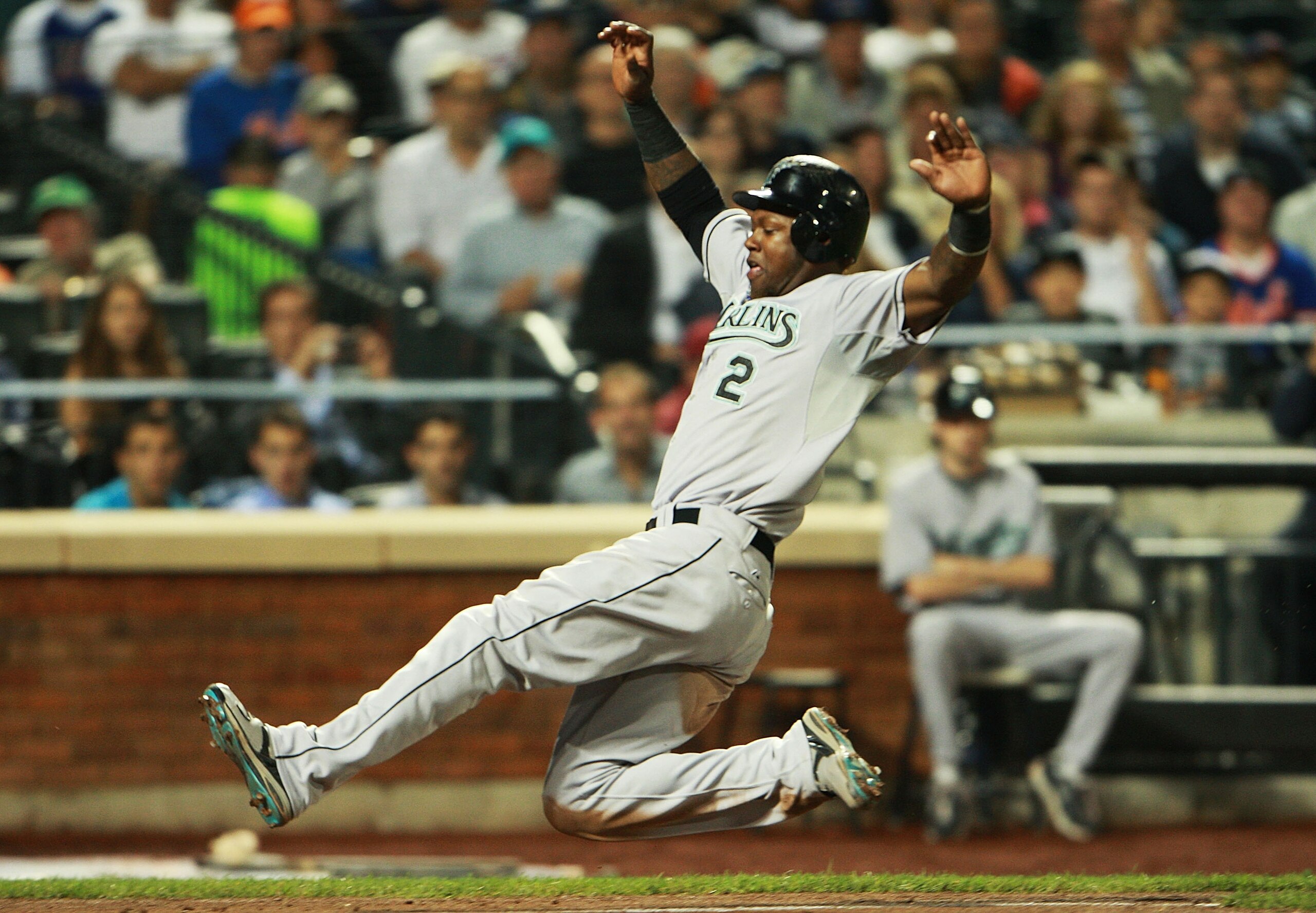 NEW YORK - AUGUST 25:  Hanley Ramirez #2 of the Florida Marlins successfully slides into home off of Gaby Sanchez's #14 (not shown) sacrifice fly in the third inning on August 25, 2010 at Citi Field in the Flushing neighborhood of the Queens borough of Ne