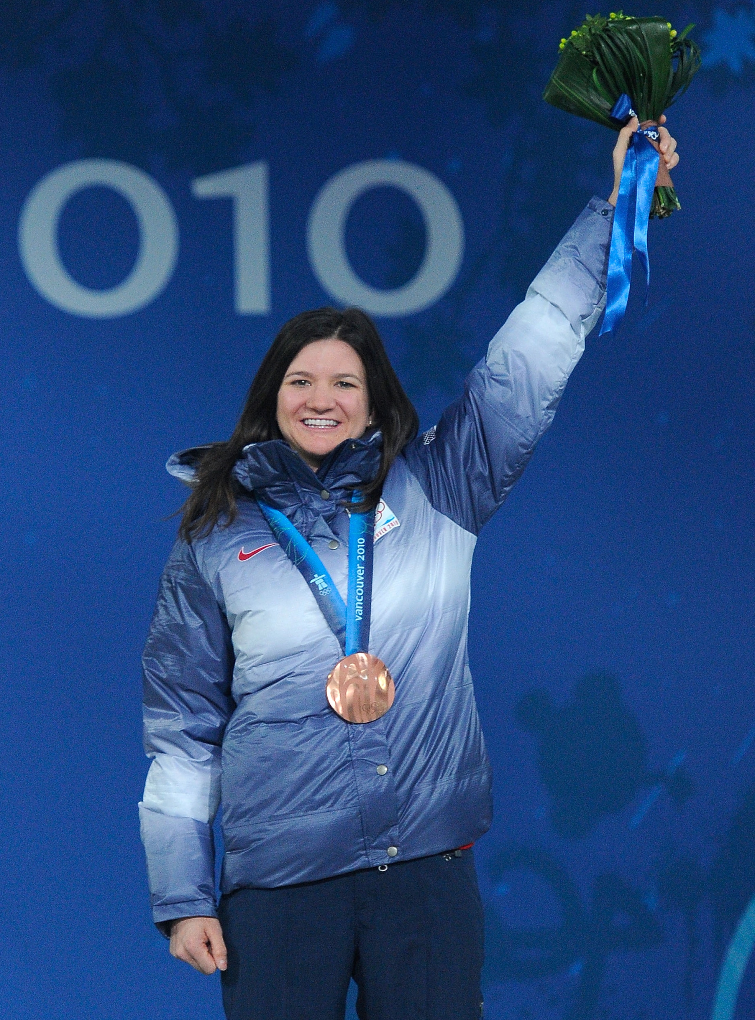 VANCOUVER, BC - FEBRUARY 19:  Kelly Clark of United States celebrates receiving the bronze medal during the medal ceremony for the women's halfpipe on day 8 of the Vancouver 2010 Winter Olympics at BC Place on February 19, 2010 in Vancouver, Canada.  (Pho