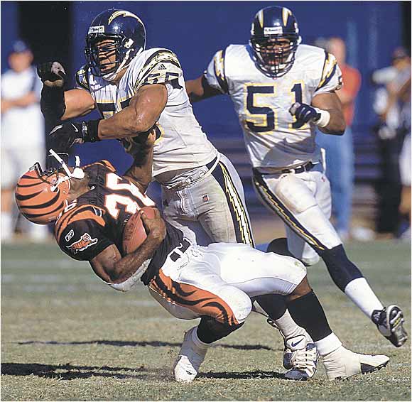 : JUNIOR SEAU SAN DIEGO CHARGERS 8X10 SPORTS ACTION