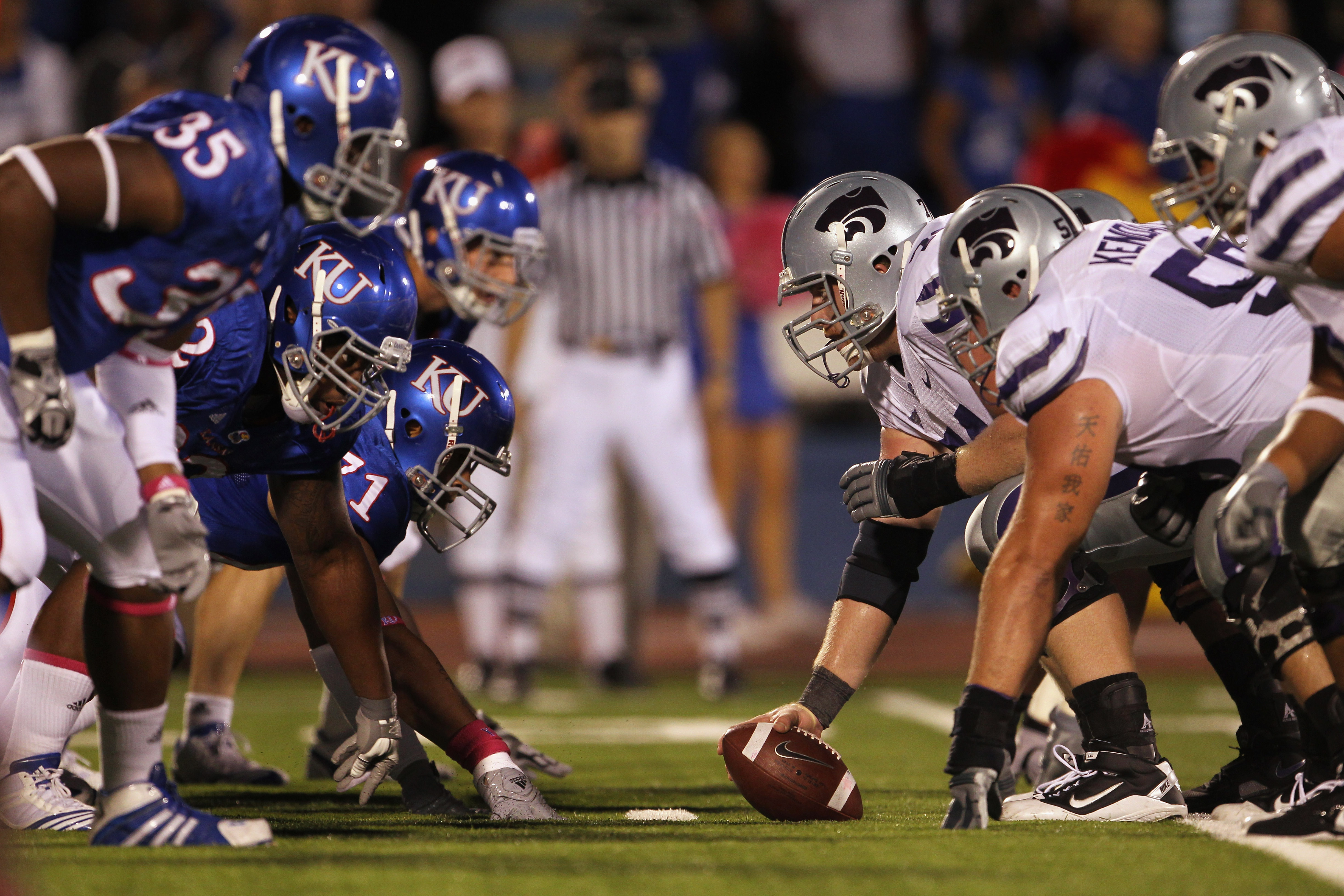 LAWRENCE, KS - OCTOBER 14: Center Wade Weibert #74 and the Kansas State Wildcats face off against the Kansas Jayhawks during the game on October 14, 2010 at Memorial Stadium in Lawrence, Kansas. (Photo by Jamie Squire/Getty Images)