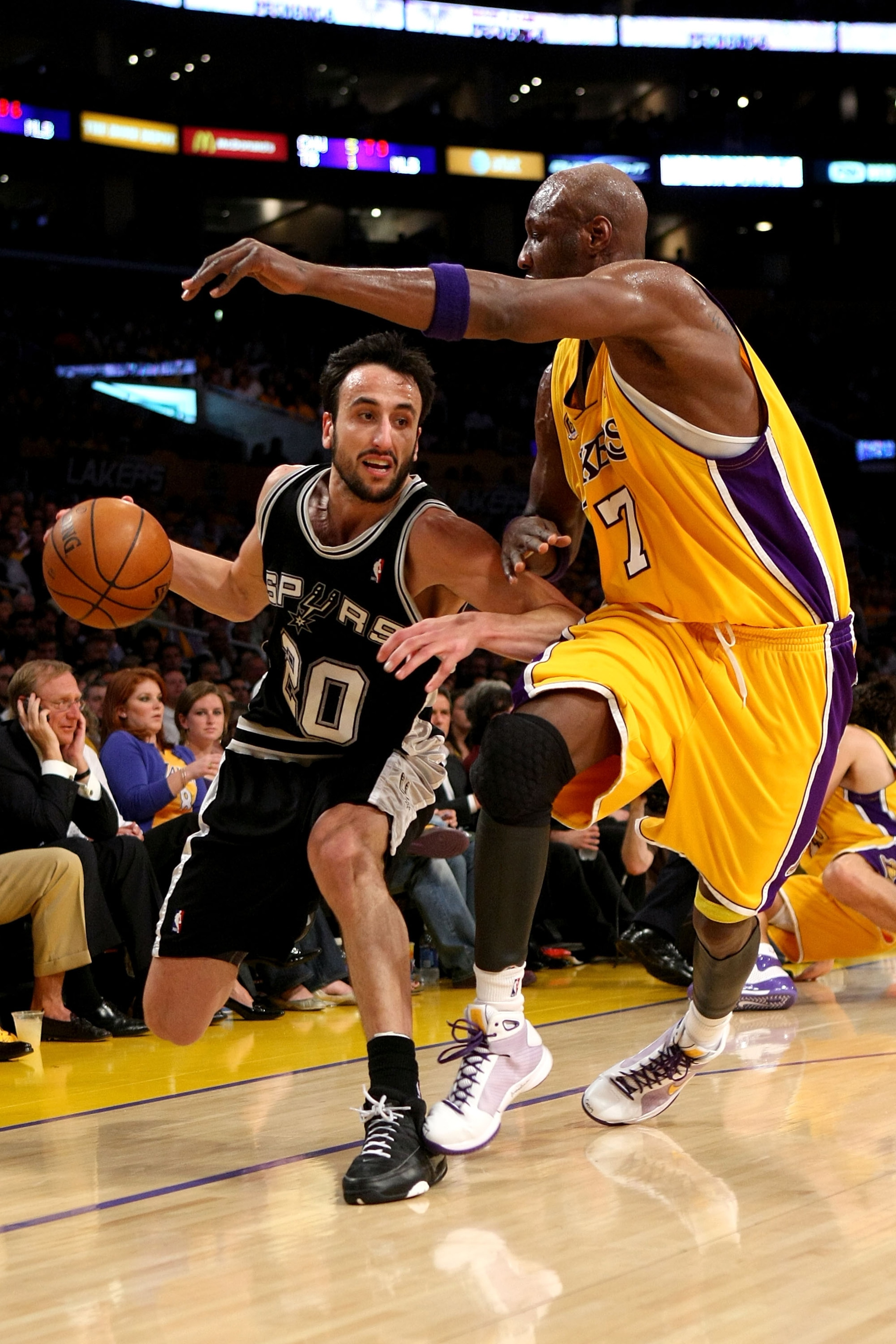 LOS ANGELES, CA - MAY 29:  Manu Ginobili #20 of the San Antonio Spurs drives to the basket against Lamar Odom #7 of the Los Angeles Lakers in Game Five of the Western Conference Finals during the 2008 NBA Playoffs on May 29, 2008 at Staples Center in Los