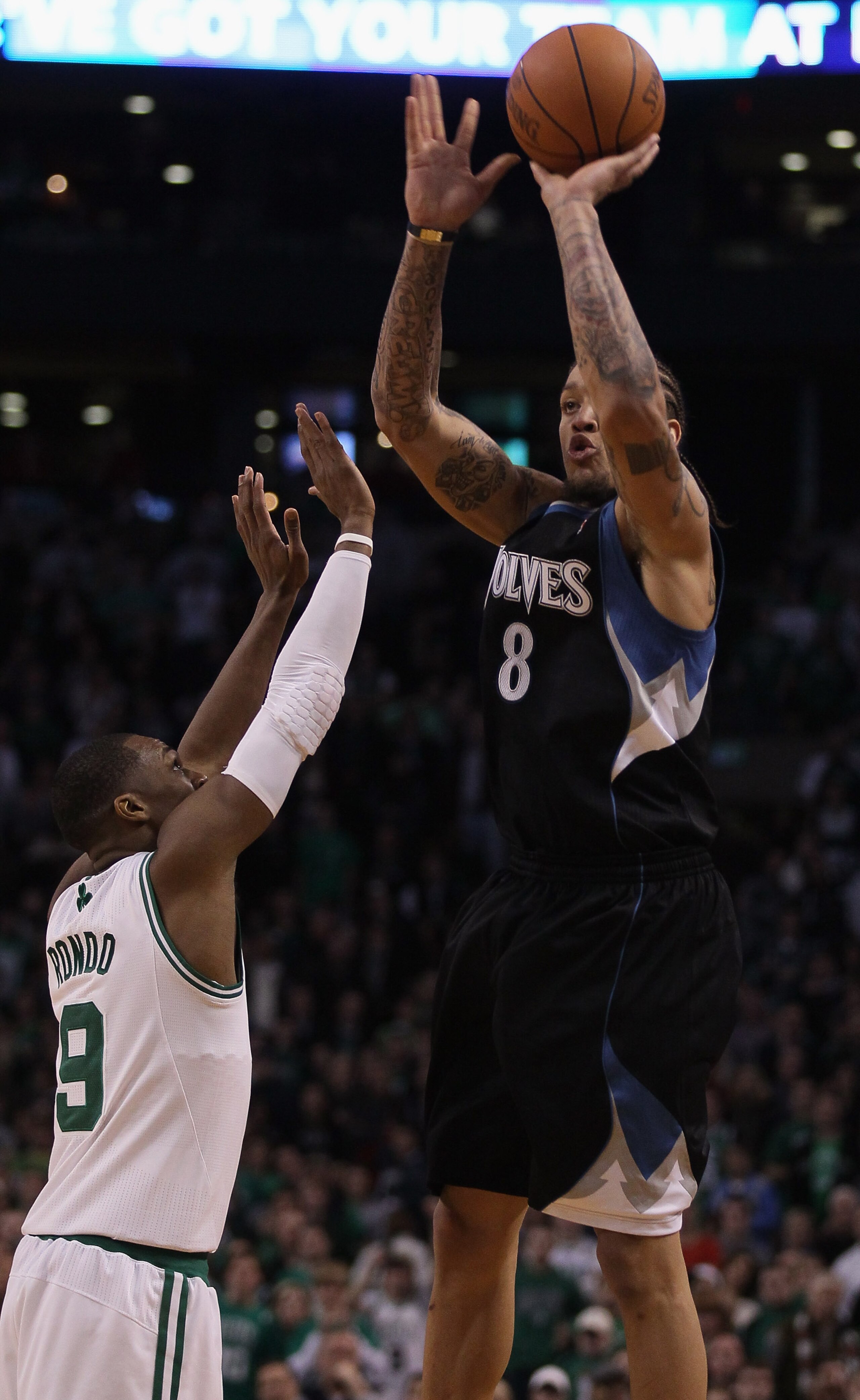 BOSTON, MA - JANUARY 03:  Michael Beasley #8 of the Minnesota Timberwolves takes the last shot of the game as Rajon Rondo #9 of the Boston Celtics defends on January 3, 2011 at the TD Garden in Boston, Massachusetts. The Celtics defeated the Timberwolves 