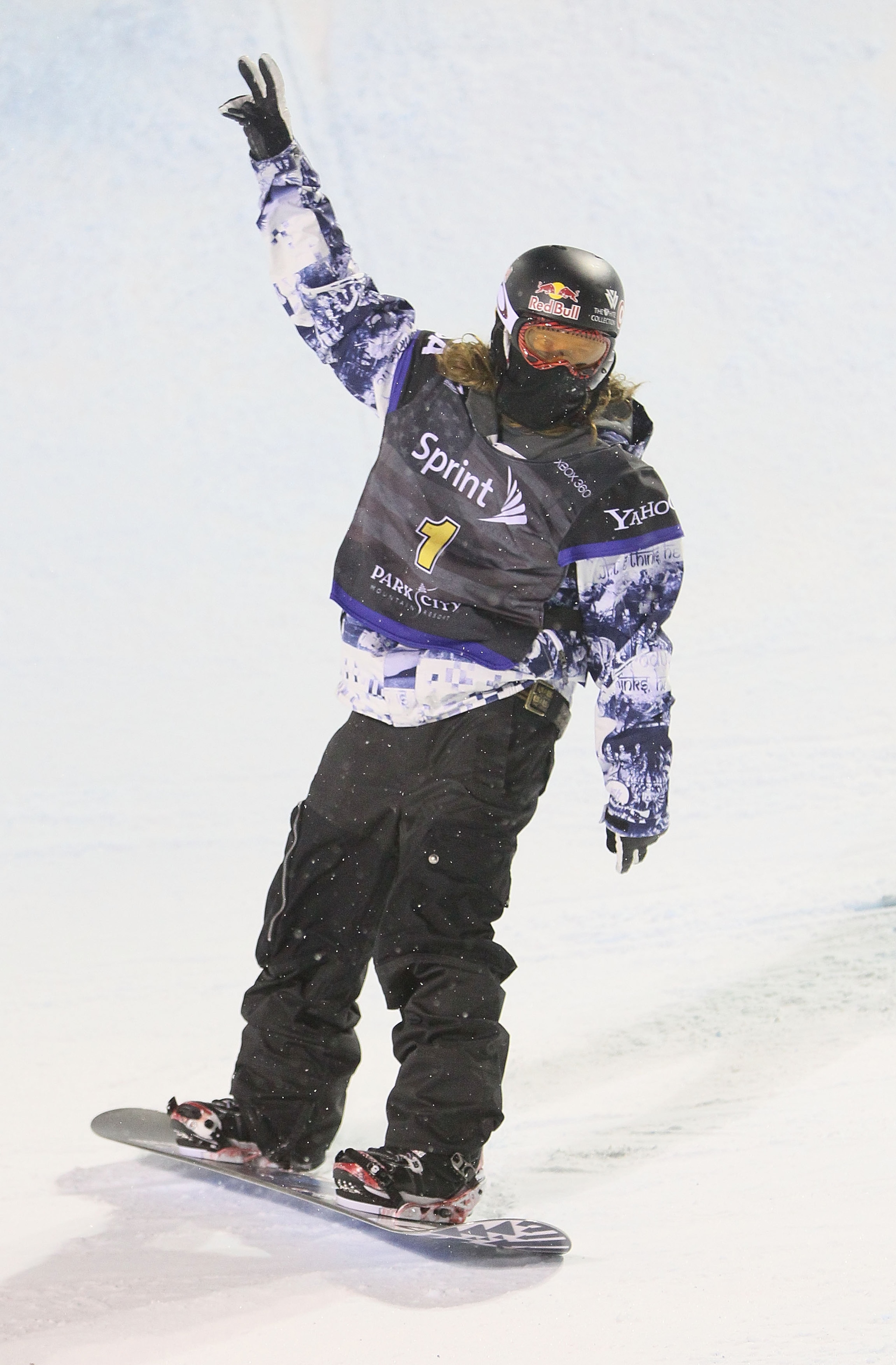 PARK CITY, UT - JANUARY 23:  Shaun White celebrates as he takes a victory lap as he won the US Snowboarding Grand Prix on January 23, 2010 in Park City, Utah.  (Photo by Doug Pensinger/Getty Images)