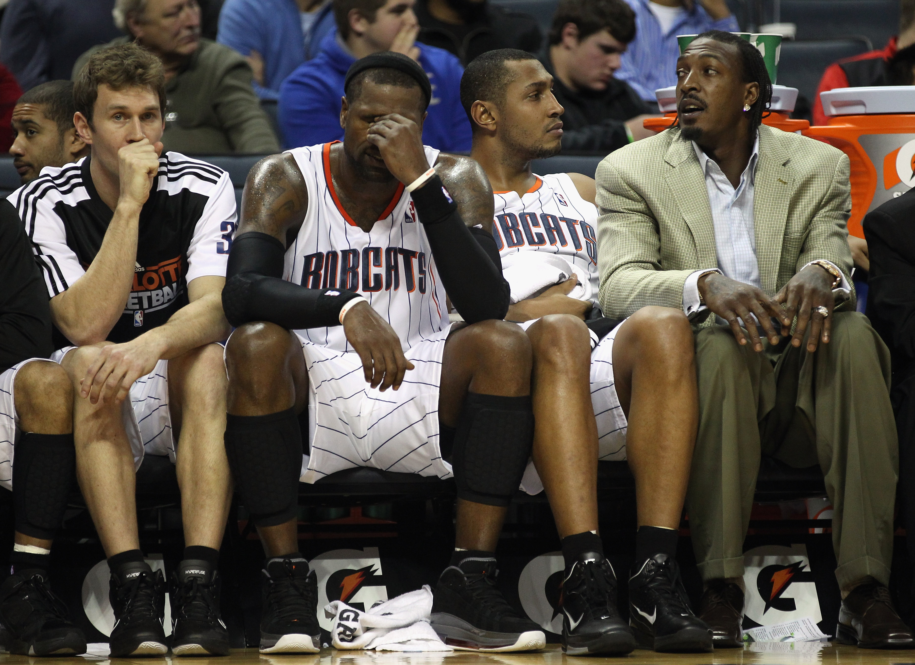 CHARLOTTE, NC - DECEMBER 21:  Teammates Matt Carroll #33, Stephen Jackson #1, Boris Diaw #32 and Gerald Wallace #3 of the Charlotte Bobcats sit on the bench during their 99-81 loss to the Oklahoma City Thunder at Time Warner Cable Arena on December 21, 20