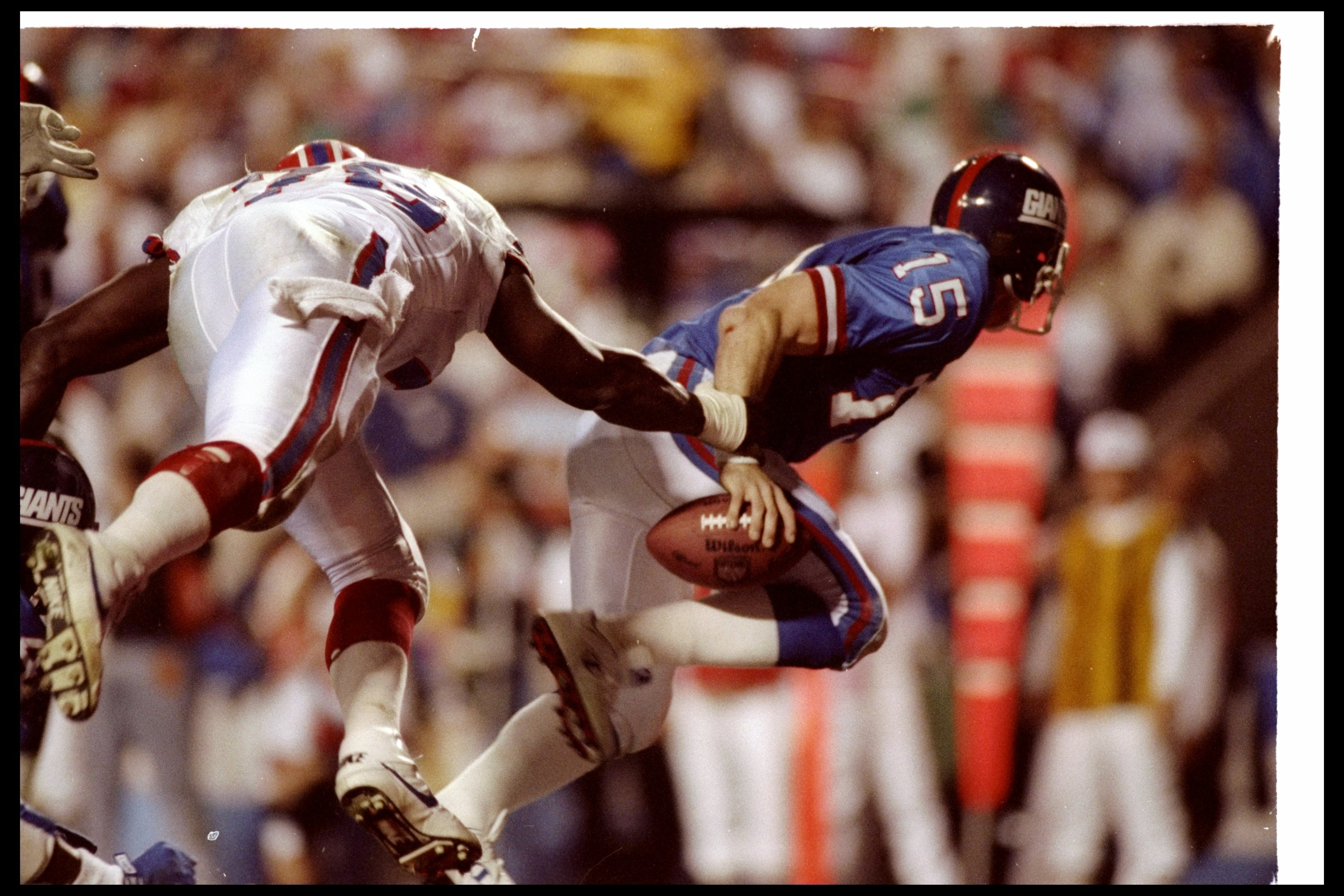 27 Jan 1991:  Quarterback Jeff Hostetler of the New York Giants gets sacked during Super Bowl XXV against the Buffalo Bills at Tampa Stadium in Tampa, Florida.  The Giants won the game, 20-19. Mandatory Credit: Mike Powell  /Allsport
