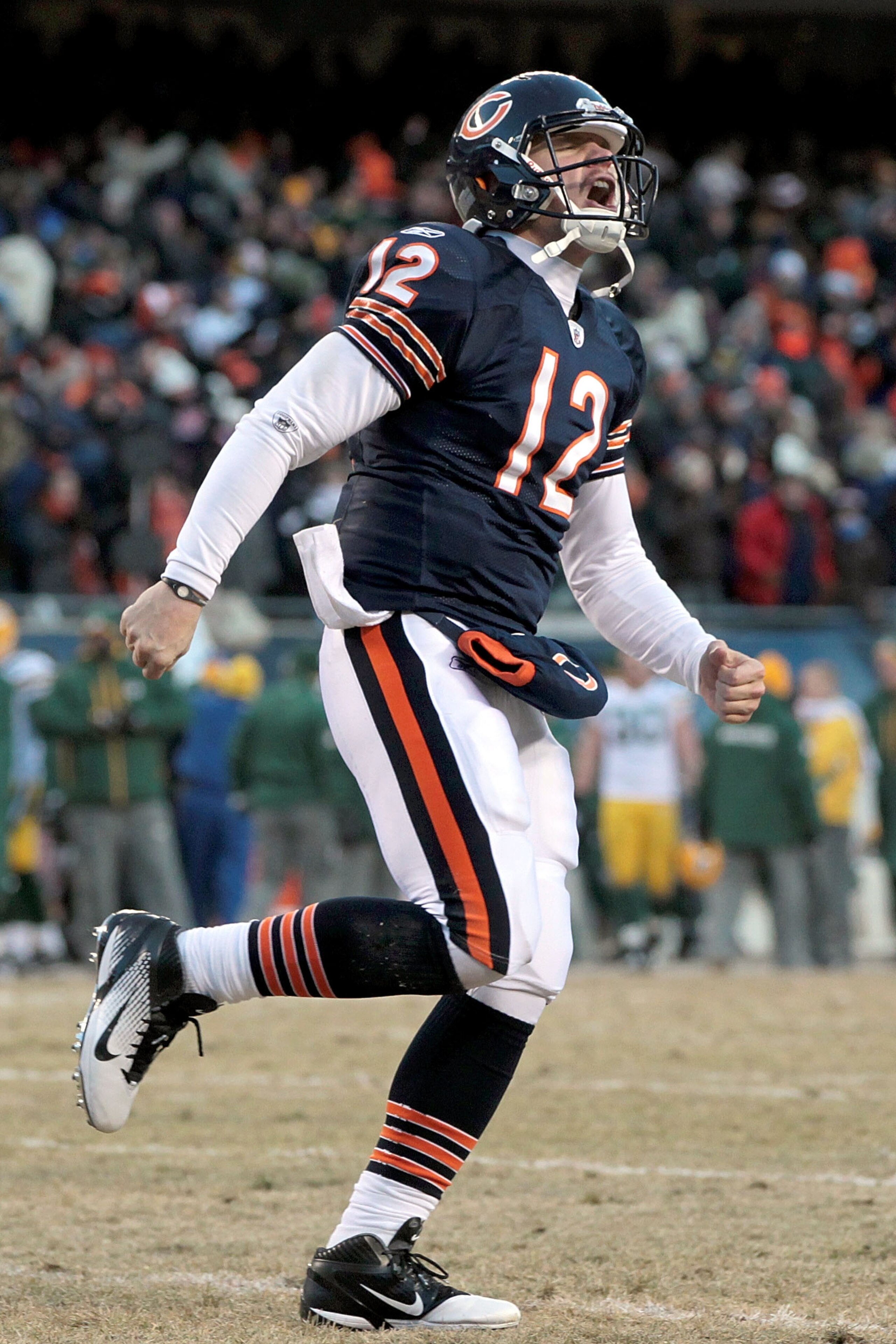 CHICAGO, IL - JANUARY 23: Quarterback Caleb Hanie #12 of the Chicago Bears reacts after Chester Taylor #29 scores a one-yard touchdown in the fourth quarter against the Green Bay Packers in the NFC Championship Game at Soldier Field on January 23, 2011 i CHICAGO, IL - JANUARY 23: Quarterback Caleb Hanie #12 of the Chicago Bears reacts after Chester Taylor #29 scores a one-yard touchdown in the fourth quarter against the Green Bay Packers in the NFC Championship Game at Soldier Field on January 23, 2011 i