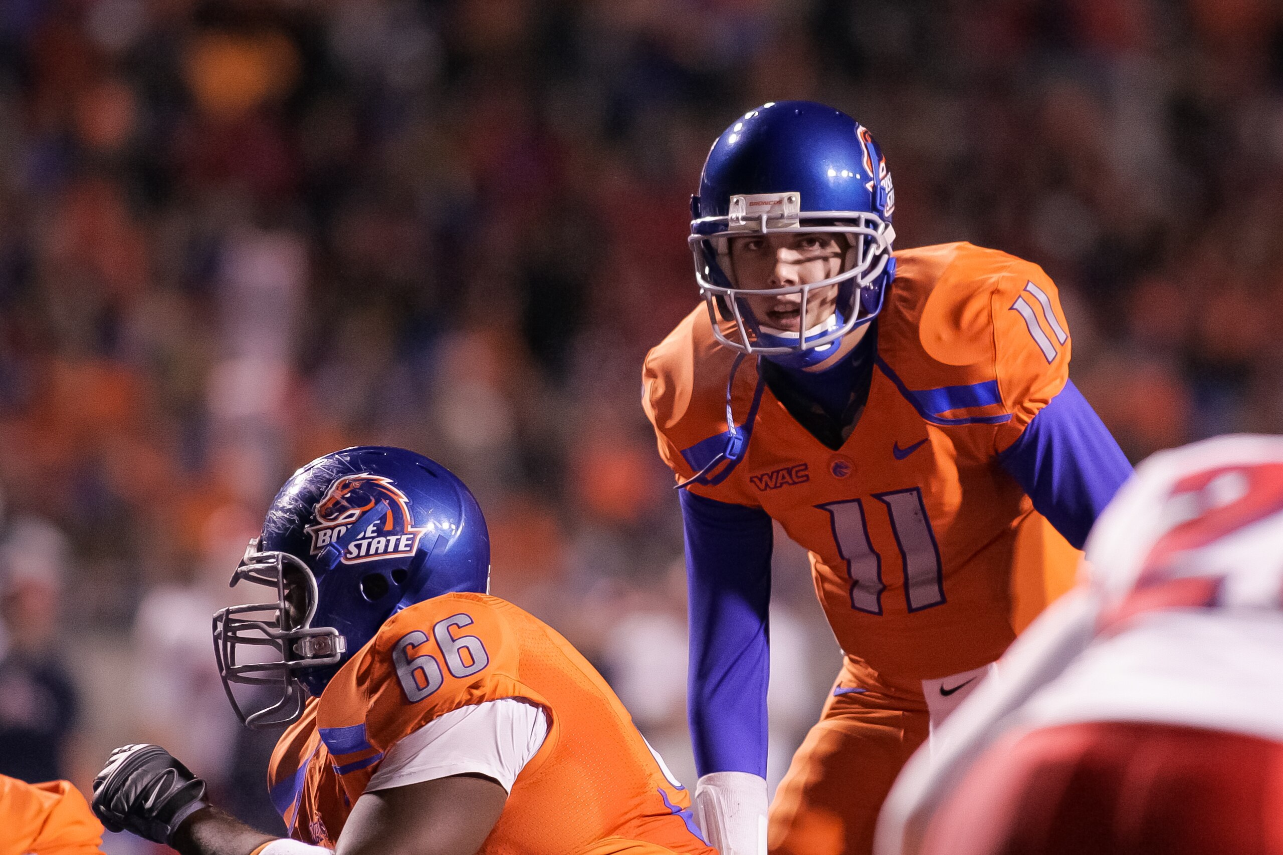 BOISE, ID - NOVEMBER 19:  Kellen Moore #11 of the Boise State Broncos calls the play against the Fresno State Bulldogs at Bronco Stadium on November 19, 2010 in Boise, Idaho.  (Photo by Otto Kitsinger III/Getty Images)