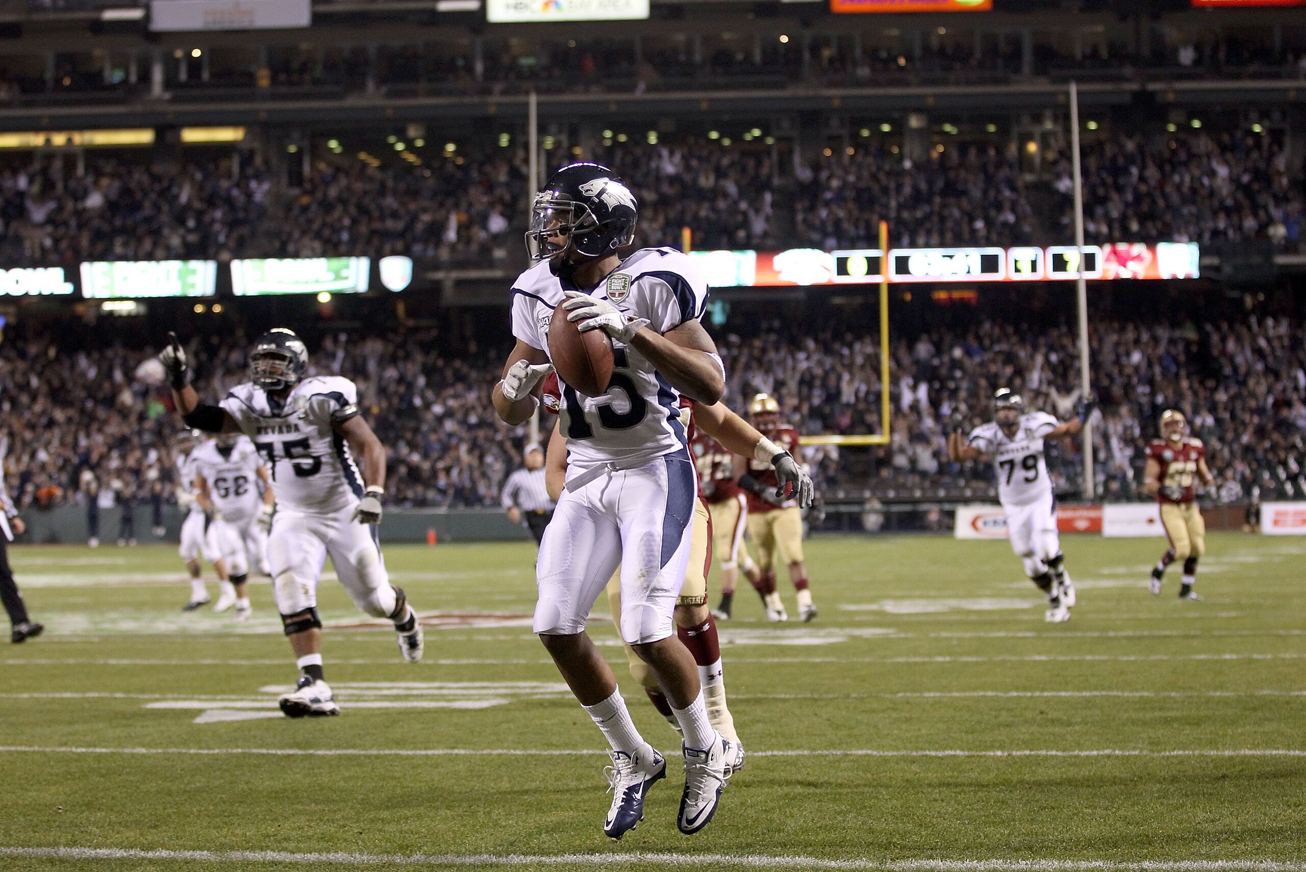 SAN FRANCISCO, CA - JANUARY 09:  Richard Matthews #15 of the Nevada Wolf Pack runs a reception in for a touchdown in their game against Boston College during the Kraft Fight Hunger Bowl at AT&T Park on January 9, 2011 in San Francisco, California.  (Photo