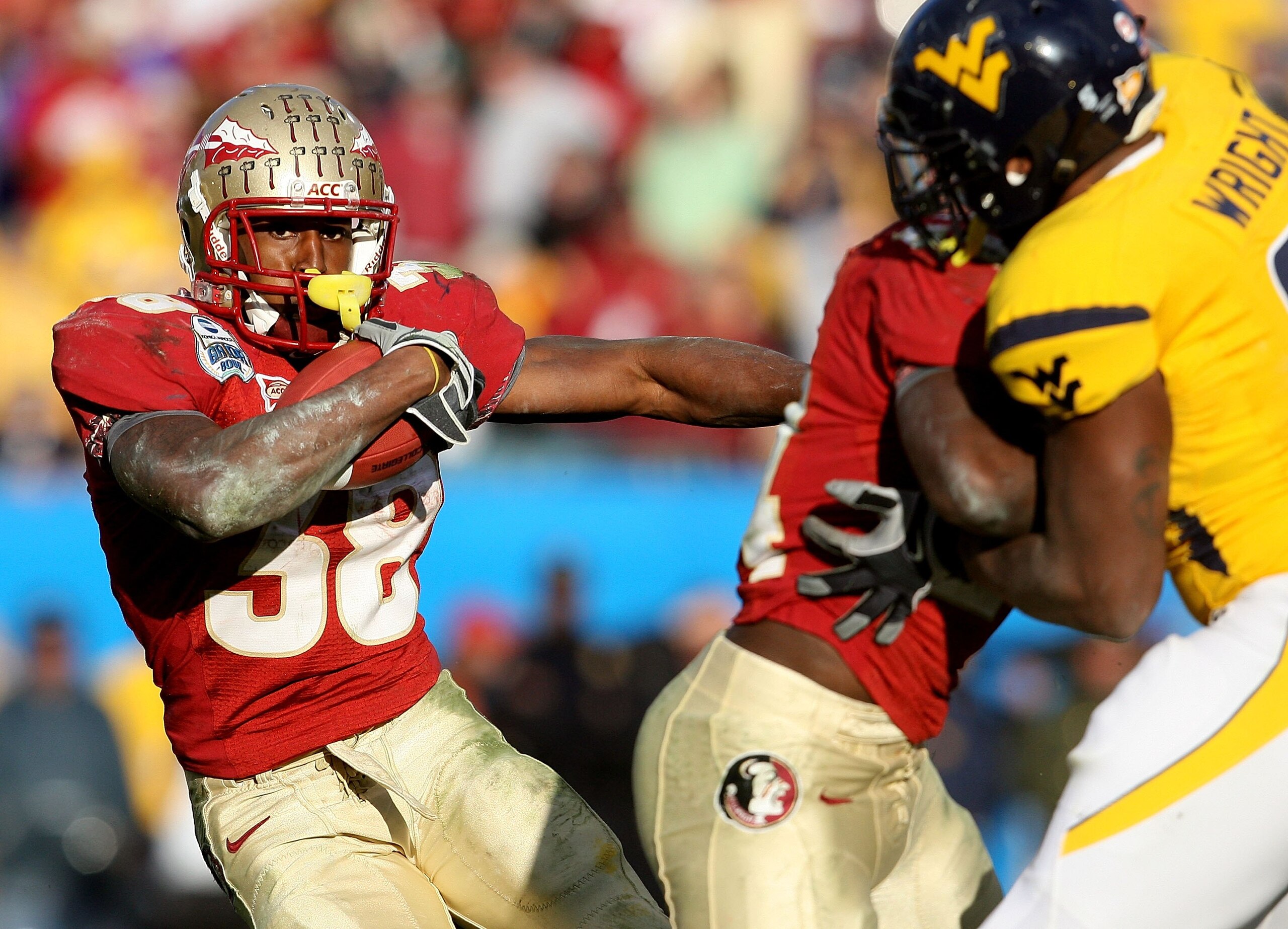 JACKSONVILLE, FL - JANUARY 01:  Running back Jermaine Thomas #38 of the Florida State Seminoles looks for room to run against the West Virginia Mountaineers during the Konica Minolta Gator Bowl on January 1, 2010 at Jacksonville Municipal Stadium in Jacks