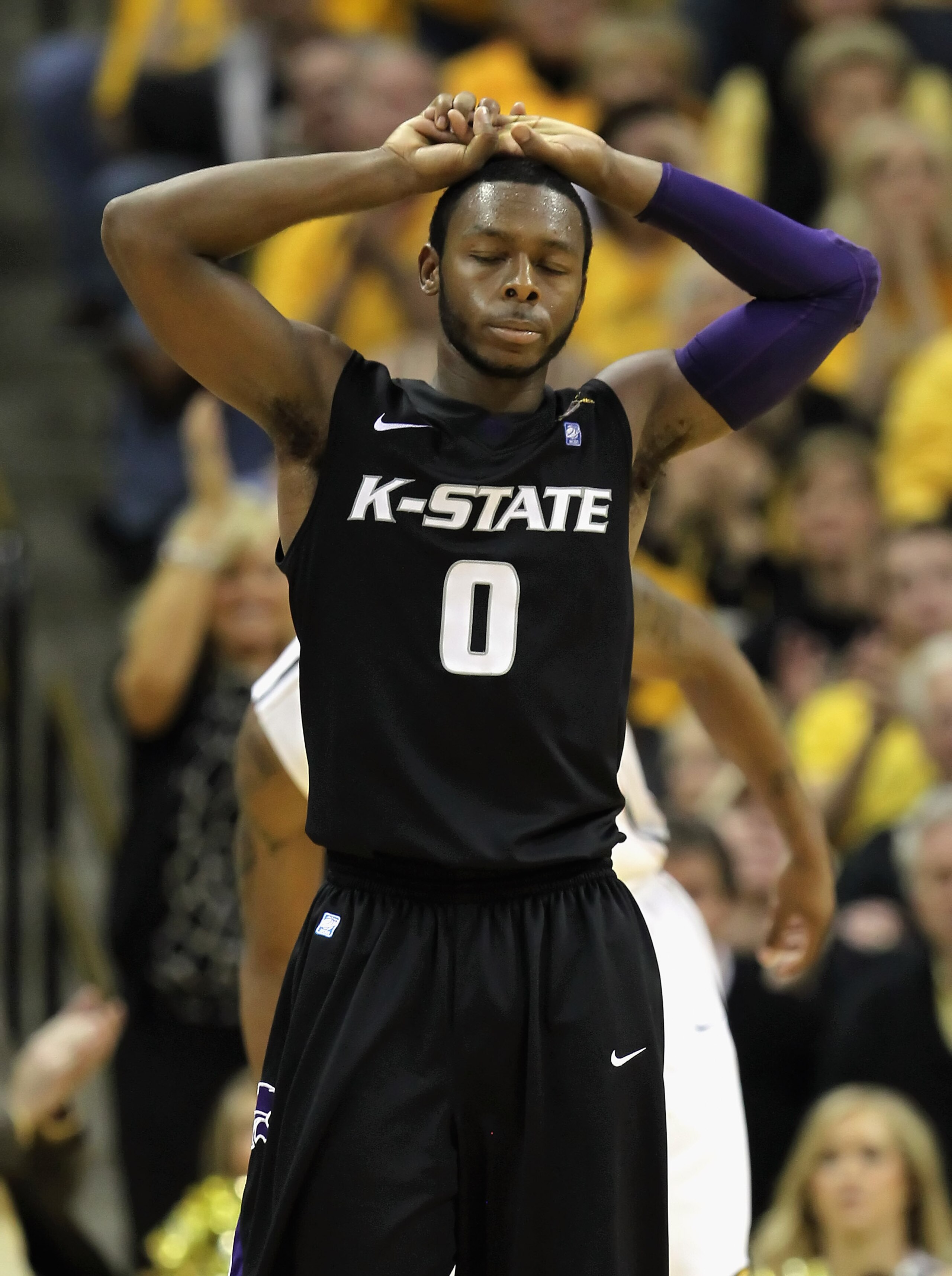 COLUMBIA, MO - JANUARY 17:  Jacob Pullen #0 of the Kansas State Wildcats reacts after committing a foul during the game against the Missouri Tigers on January 17, 2011 at Mizzou Arena in Columbia, Missouri.  (Photo by Jamie Squire/Getty Images)