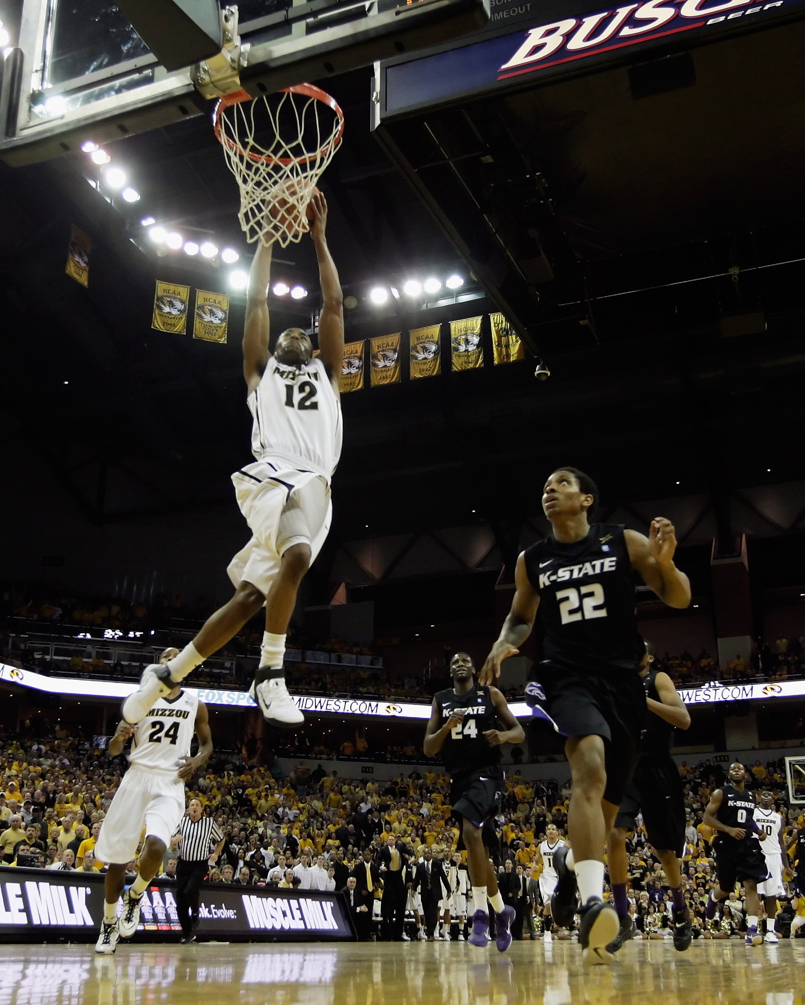 COLUMBIA, MO - JANUARY 17:  Marcus Denmon #12 of the Missouri Tigers dunks against Rodney McGruder #22 and the Kansas State Wildcats during the game on January 17, 2011 at Mizzou Arena in Columbia, Missouri.  (Photo by Jamie Squire/Getty Images)