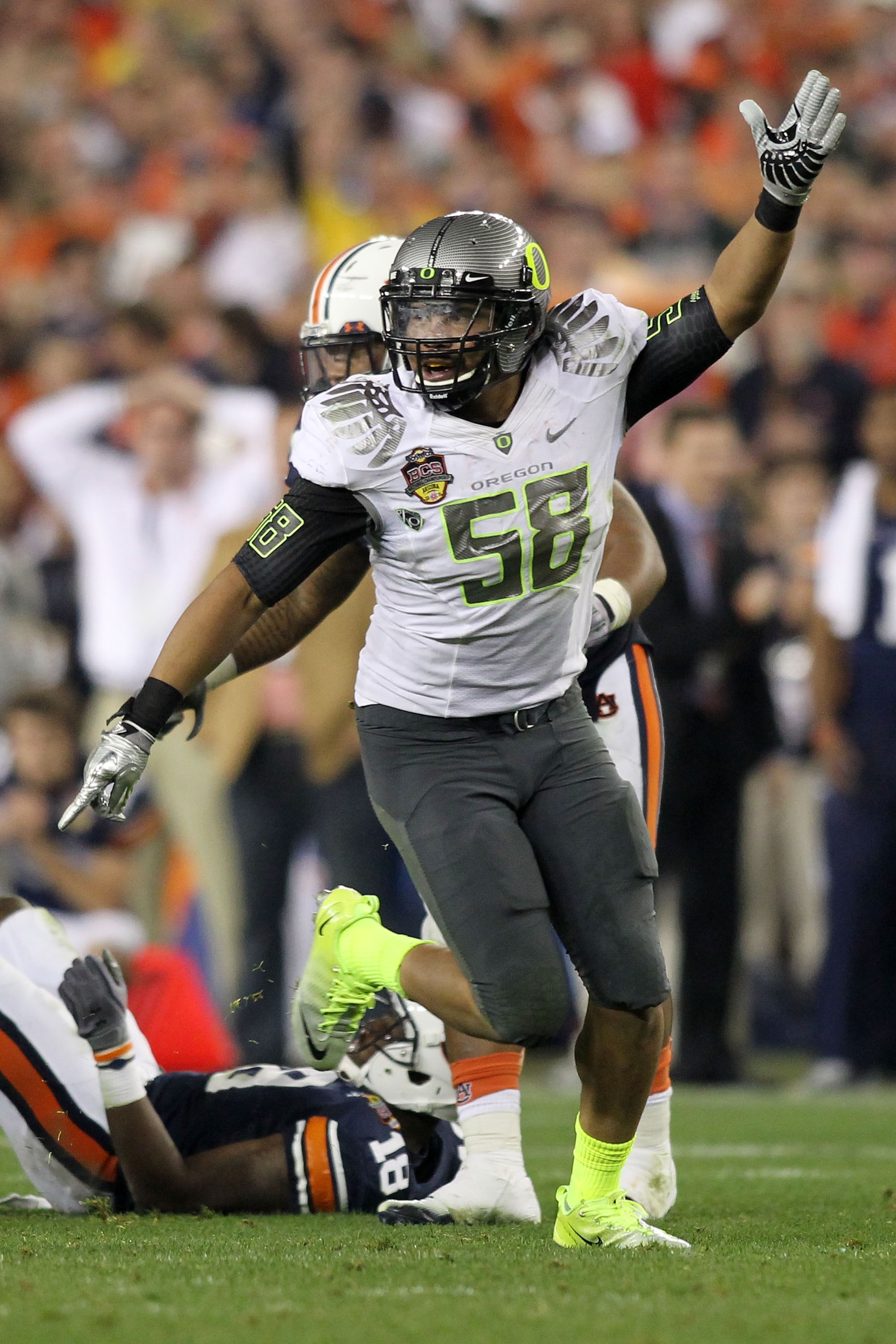 GLENDALE, AZ - JANUARY 10:  Kenny Rowe #58 of the Oregon Ducks reacts during their game against the Auburn Tigers during the Tostitos BCS National Championship Game at University of Phoenix Stadium on January 10, 2011 in Glendale, Arizona.  (Photo by Jona