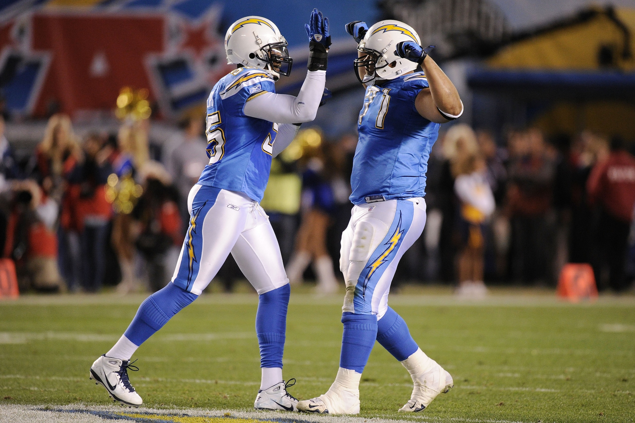 SAN DIEGO, CA - DECEMBER 16:  Defensive tackle Antonio Garay #71 of the San Diego Chargers celebrates with Shaun Philips #95 after a sack of quarterback Alex Smith #11 of the San Francisco 49ers in the second quarter at Qualcomm Stadium on December 16, 20