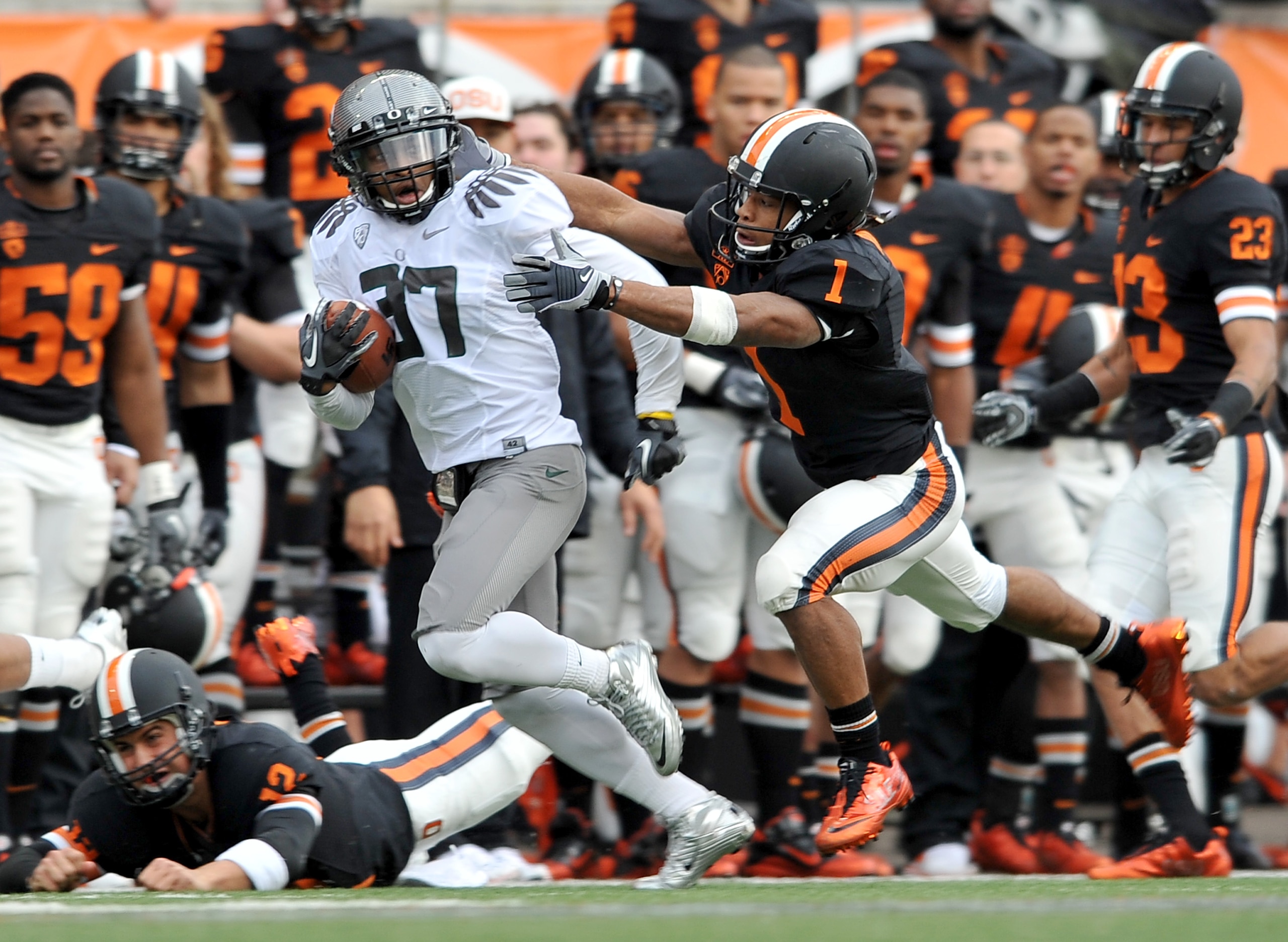 CORVALLIS, OR - DECEMBER 4: Talmadge Jackson III #37 of the Oregon Ducks runs back an interception as Jacquizz Rodgers #1 of the Oregon State Beavers tries to bring him down in the second quarter the game at Reser Stadium on December 4, 2010 in Corvallis,