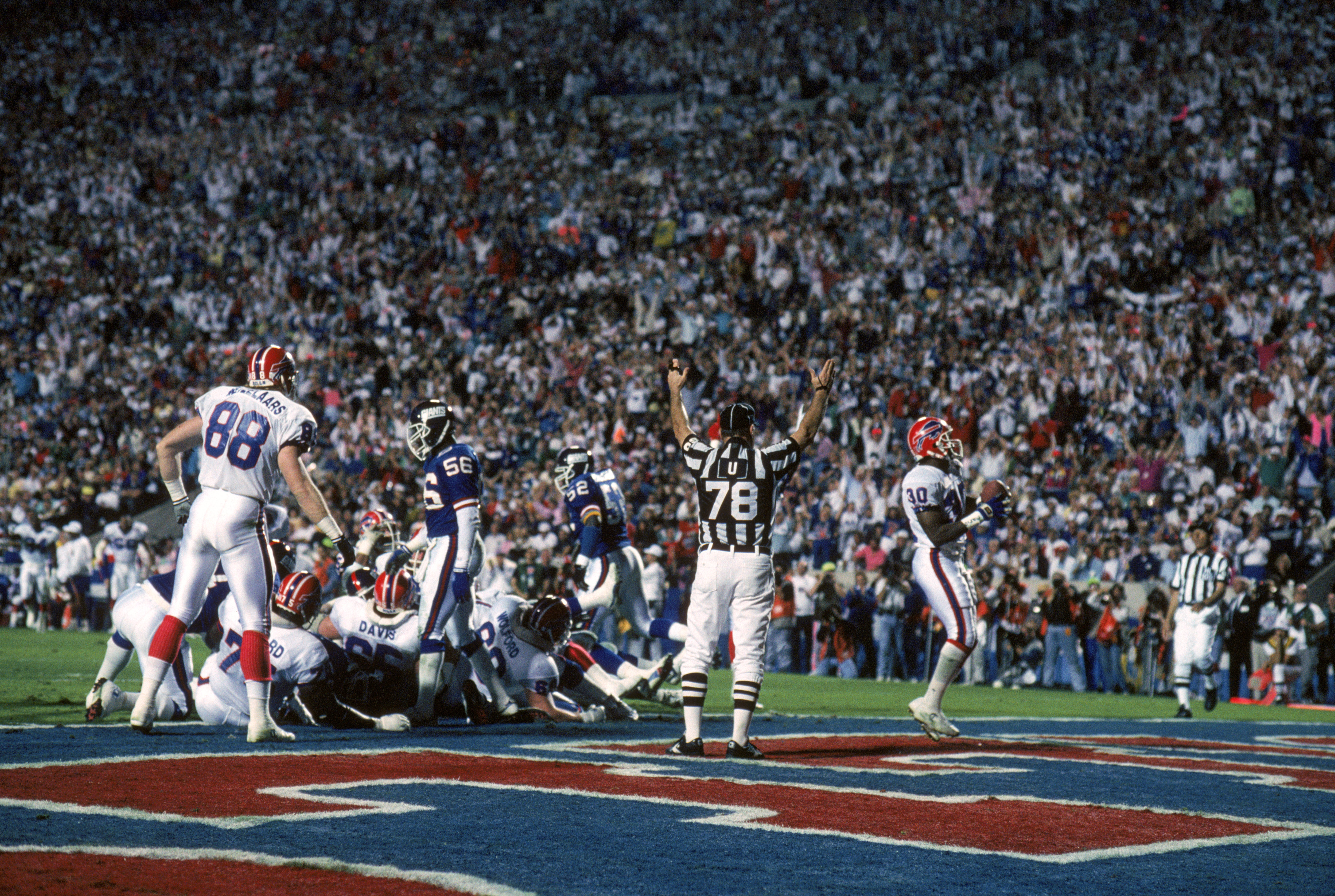 TAMPA, FL - JANUARY 27:  Running back Don Smith #30 of the Buffalo Bills celebrates after a one yard touchdown run during Super Bowl XXV against the New York Giants at Tampa Stadium on January 27, 1991 in Tampa, Florida.  The Giants won 20-19.  (Photo by