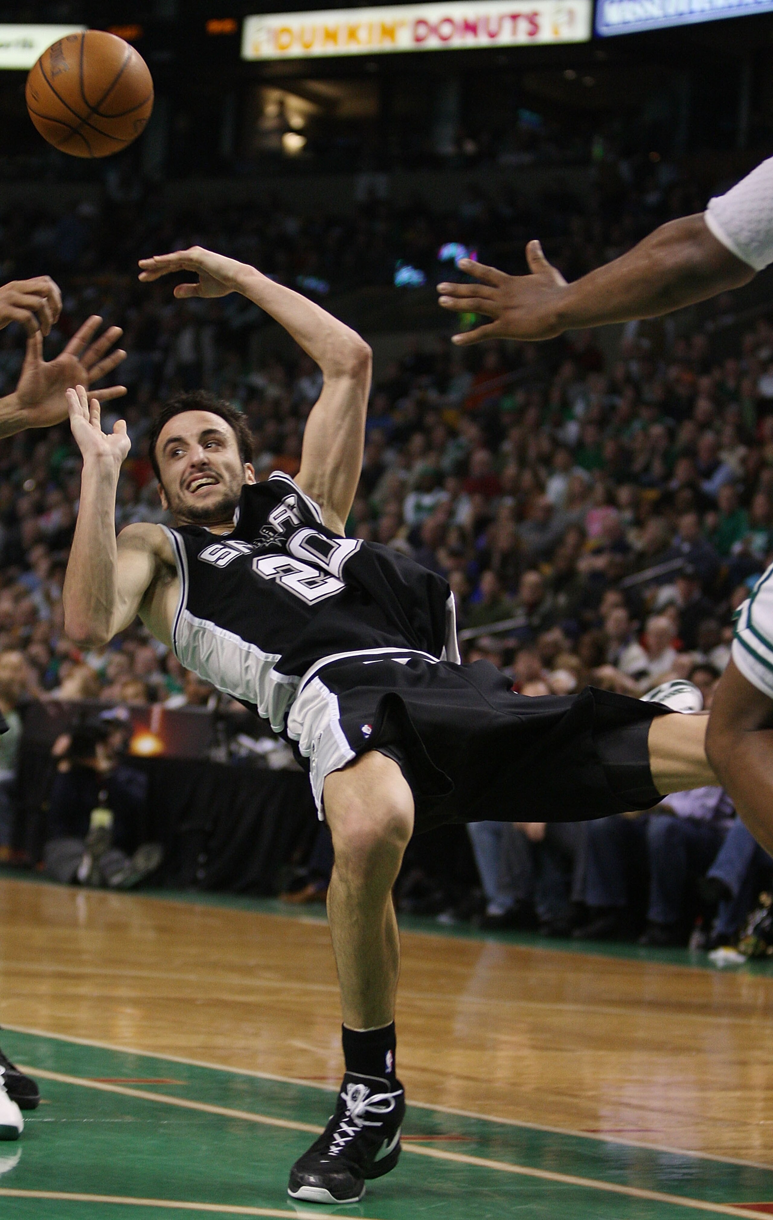 BOSTON - FEBRUARY 10: Manu Ginobili #20 of the San Antonio Spurs loses his balance and the ball in the second half against the Boston Celtics on February 10, 2008 at the TD Banknorth Garden in Boston, Massachusetts. The Boston Celtics defeated the San An BOSTON - FEBRUARY 10: Manu Ginobili #20 of the San Antonio Spurs loses his balance and the ball in the second half against the Boston Celtics on February 10, 2008 at the TD Banknorth Garden in Boston, Massachusetts. The Boston Celtics defeated the San An