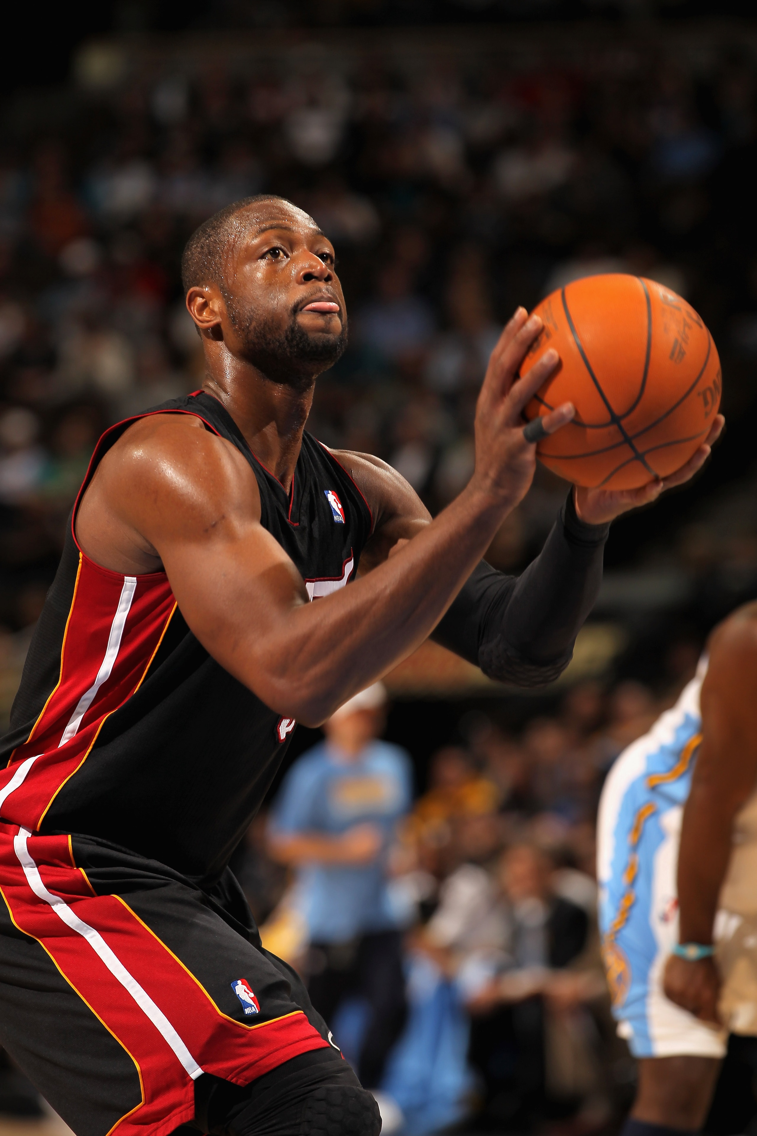 DENVER, CO - JANUARY 13: Dwayne Wade #3 of the Miami Heat takes a free throw against the Denver Nuggets at the Pepsi Center on January 13, 2011 in Denver, Colorado. The Nuggets defeated the Heat 130-102. NOTE TO USER: User expressly acknowledges and agre DENVER, CO - JANUARY 13: Dwayne Wade #3 of the Miami Heat takes a free throw against the Denver Nuggets at the Pepsi Center on January 13, 2011 in Denver, Colorado. The Nuggets defeated the Heat 130-102. NOTE TO USER: User expressly acknowledges and agre