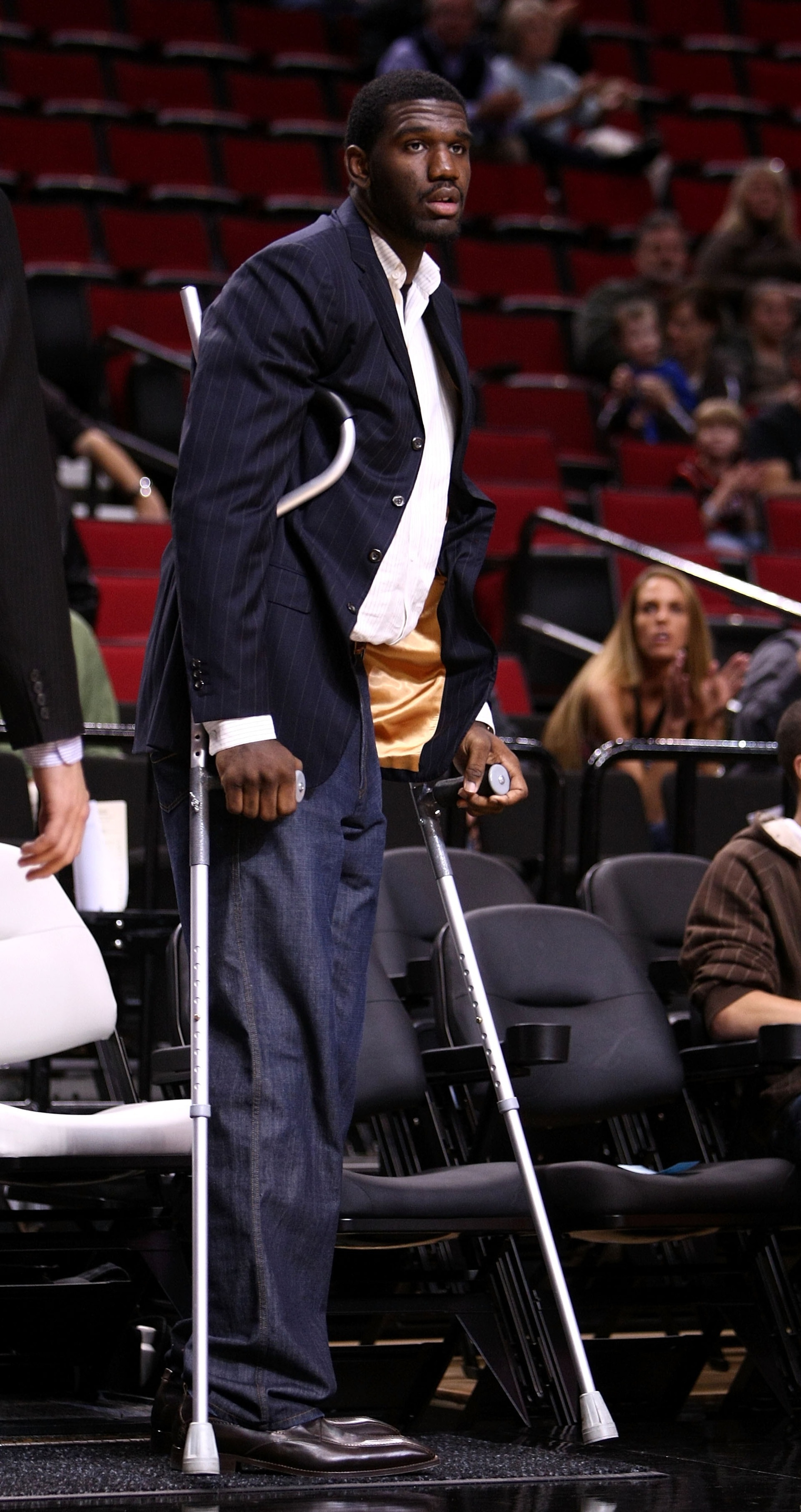 PORTLAND, OR - OCTOBER 10: Greg Oden #52 of the Portland Trail Blazers, who is out for the season after under going micro fracture surgery in his knee, sits on the bench to watch a pre-season game against the Los Angeles Clippers at the Rose Garden on Oc PORTLAND, OR - OCTOBER 10: Greg Oden #52 of the Portland Trail Blazers, who is out for the season after under going micro fracture surgery in his knee, sits on the bench to watch a pre-season game against the Los Angeles Clippers at the Rose Garden on Oc