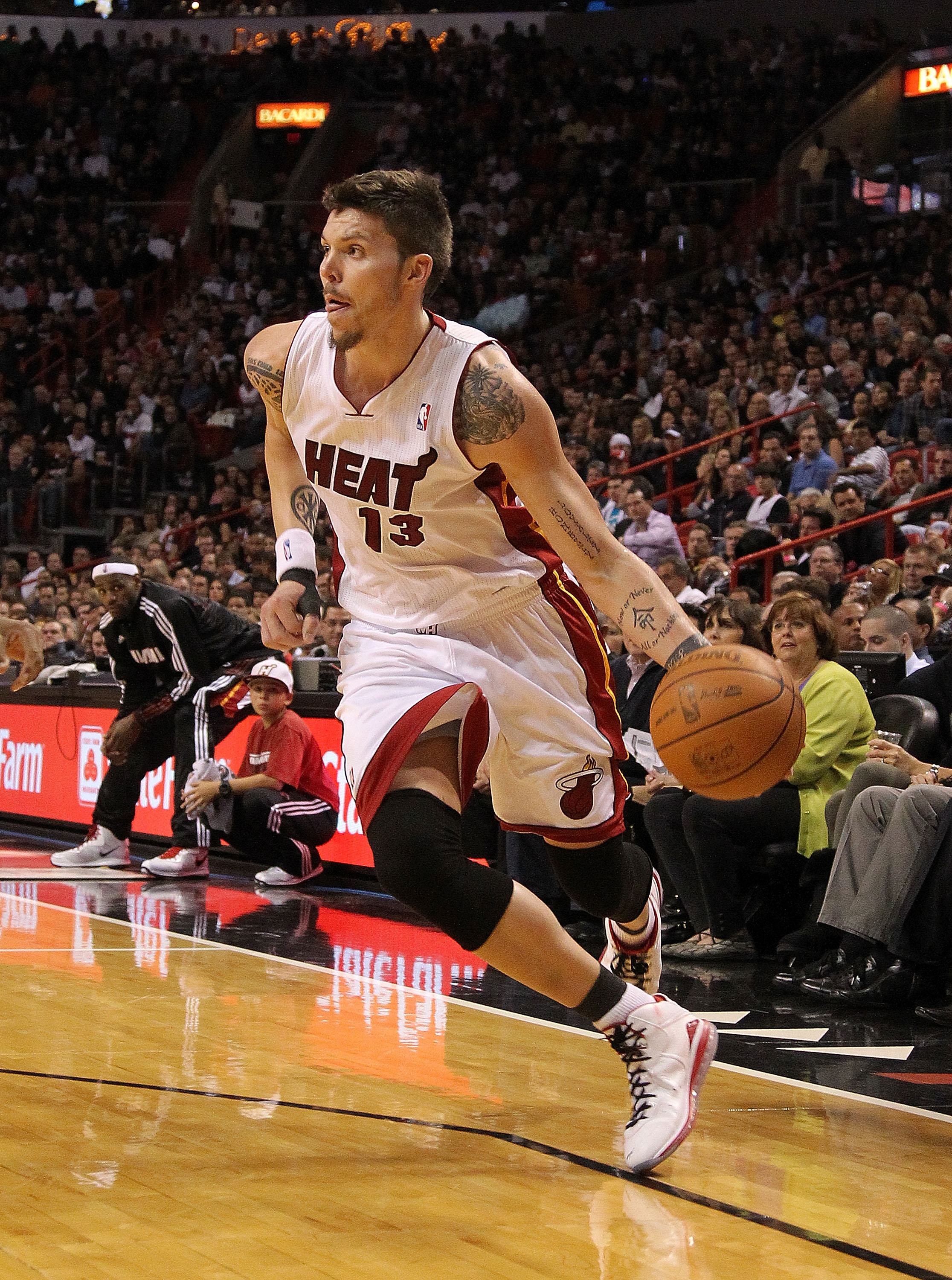 MIAMI, FL - JANUARY 22:  Mike Miller #13 of the Miami Heat dribbles into the lane during a game against the Toronto Raptors at American Airlines Arena on January 22, 2011 in Miami, Florida. NOTE TO USER: User expressly acknowledges and agrees that, by dow