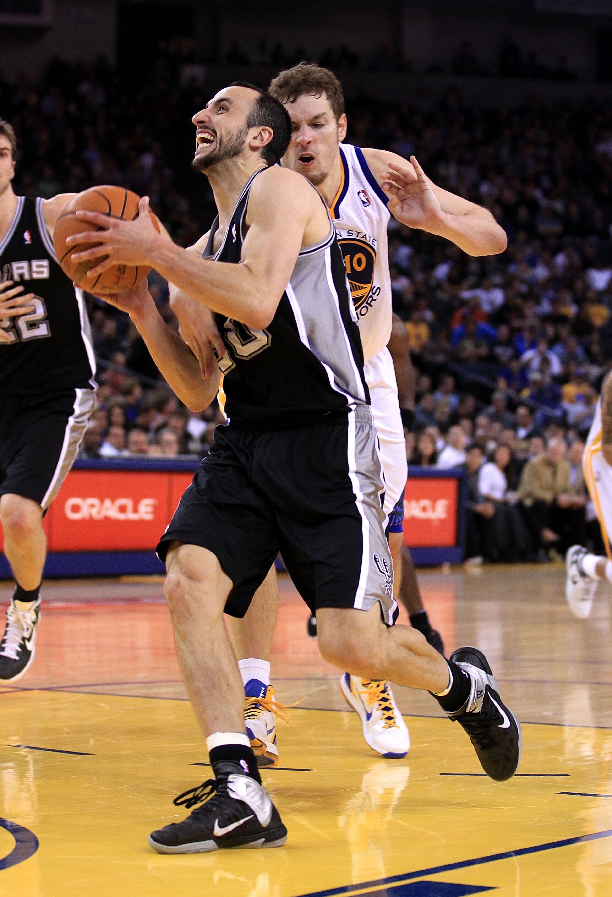 OAKLAND, CA - JANUARY 24:  Manu Ginobili #20 of the San Antonio Spurs in action against the Golden State Warriors at Oracle Arena on January 24, 2011 in Oakland, California.  NOTE TO USER: User expressly acknowledges and agrees that, by downloading and or