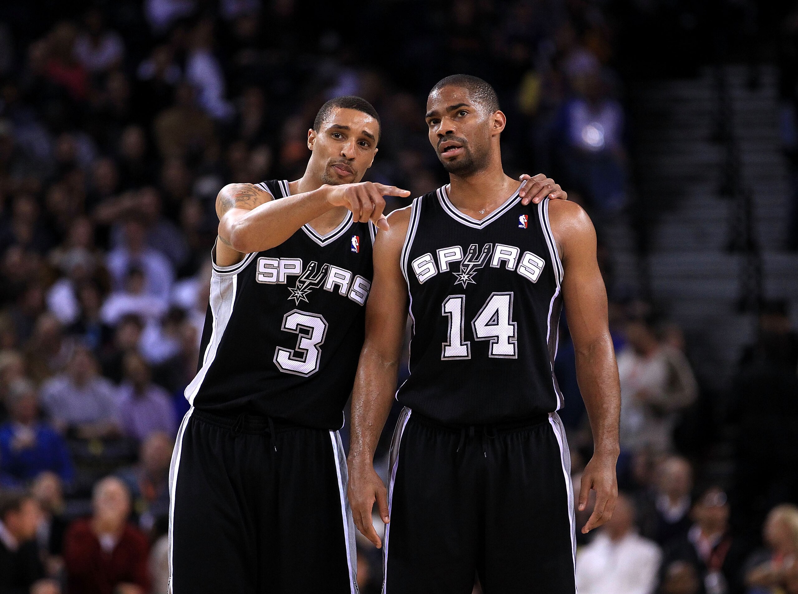OAKLAND, CA - JANUARY 24:  George Hill #3 talks to Gary Neal #14 of the San Antonio Spurs during their game against the Golden State Warriors at Oracle Arena on January 24, 2011 in Oakland, California.  NOTE TO USER: User expressly acknowledges and agrees