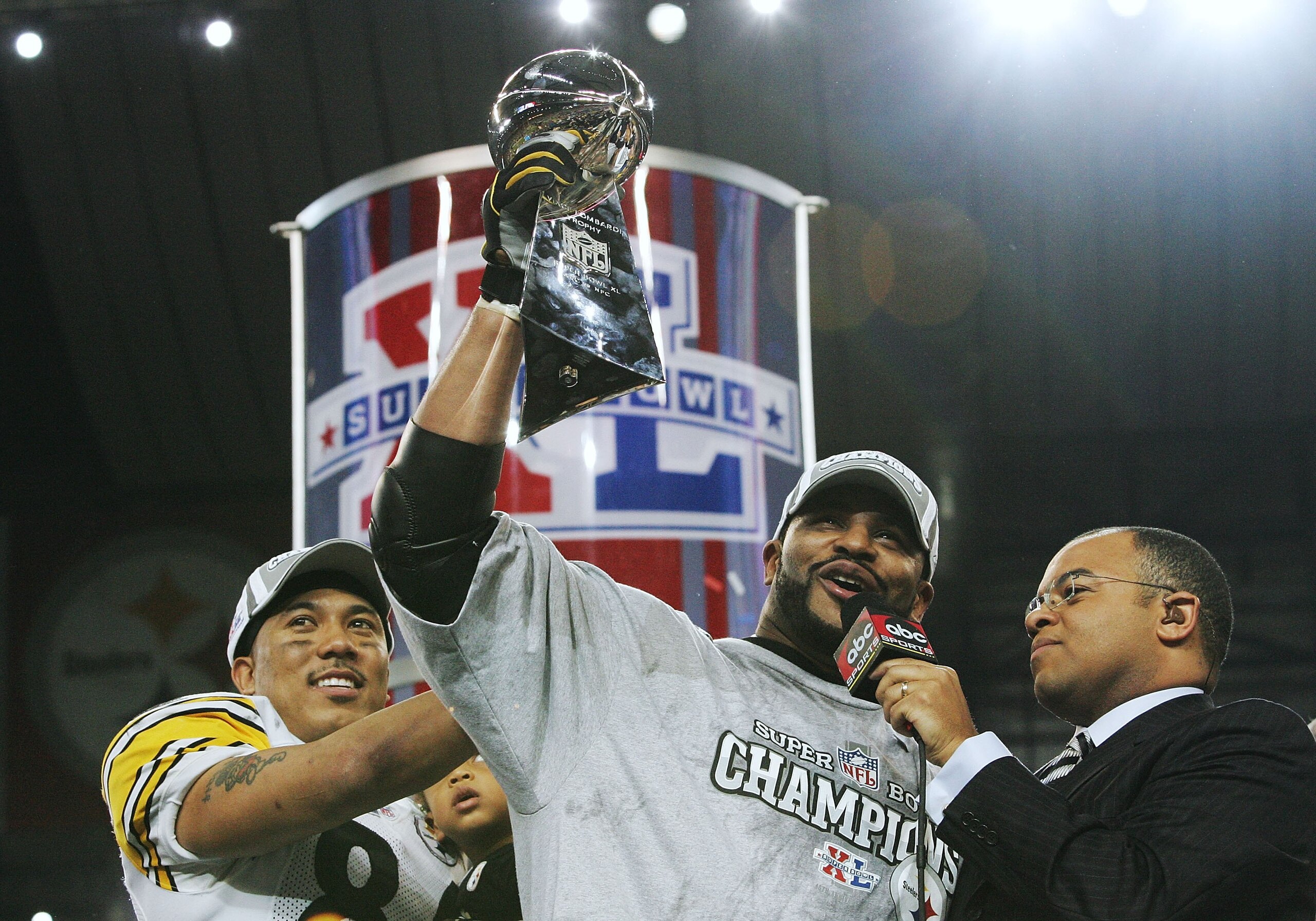 DETROIT - FEBRUARY 05:  Running back Jerome Bettis #36 (M) and game MVP wide receiver Hines Ward #86 of the Pittsburgh Steelers celebrate with the Vince Lombardi Tropy after defeating the Seattle Seahawks in Super Bowl XL at Ford Field on February 5, 2006