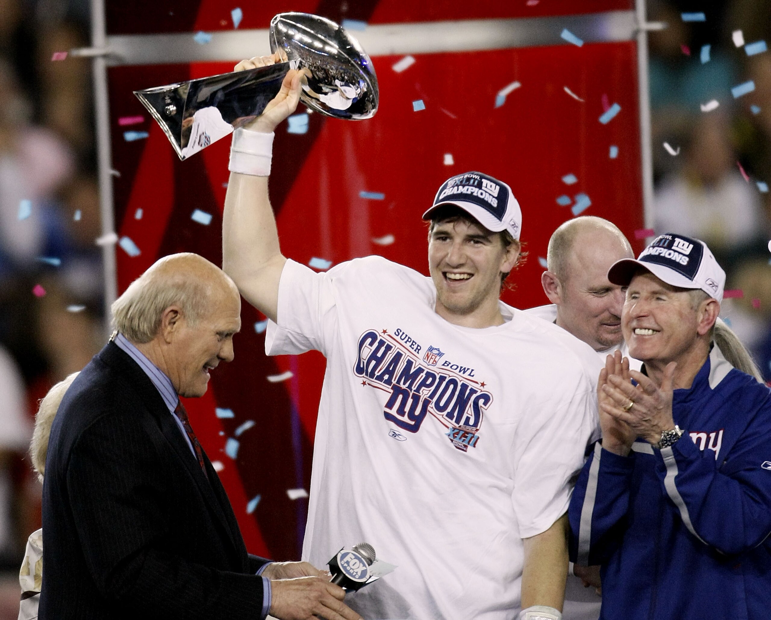 GLENDALE, AZ - FEBRUARY 03:  Quarterback Eli Manning #10 of the New York Giants holds the Vince Lombardi Trophy after defeating the New England Patriots 17 0 14 after Super Bowl XLII on February 3, 2008 at the University of Phoenix Stadium in Glendale, Ar