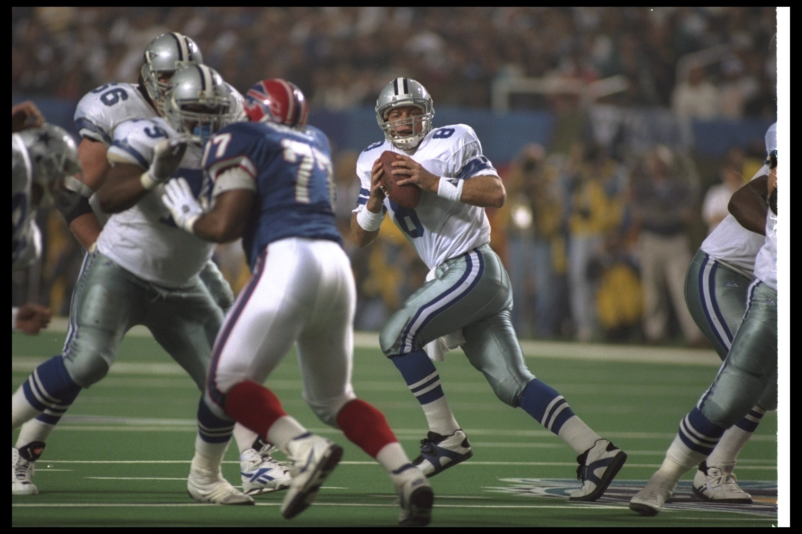30 Jan 1994:  Quarterback Troy Aikman of the Dallas Cowboys drops back to pass during the fourth quarter of Super Bowl XXVIII against the Buffalo Bills at the Georgia Dome in Atlanta, Georgia.  The Cowboys won the game, 30-13. Mandatory Credit: Rick Stewa