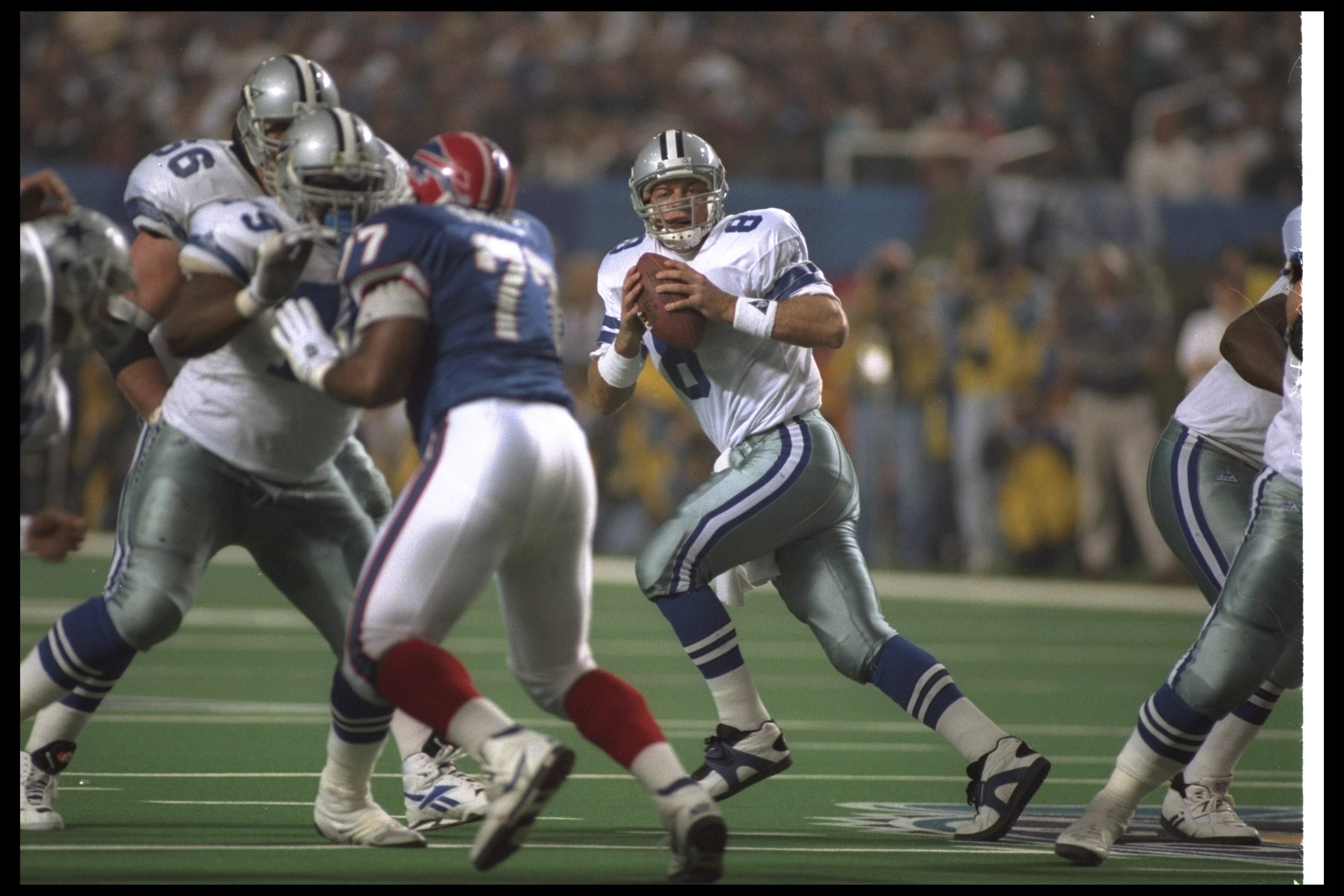 30 Jan 1994:  Quarterback Troy Aikman of the Dallas Cowboys drops back to pass during the fourth quarter of Super Bowl XXVIII against the Buffalo Bills at the Georgia Dome in Atlanta, Georgia.  The Cowboys won the game, 30-13. Mandatory Credit: Rick Stewa