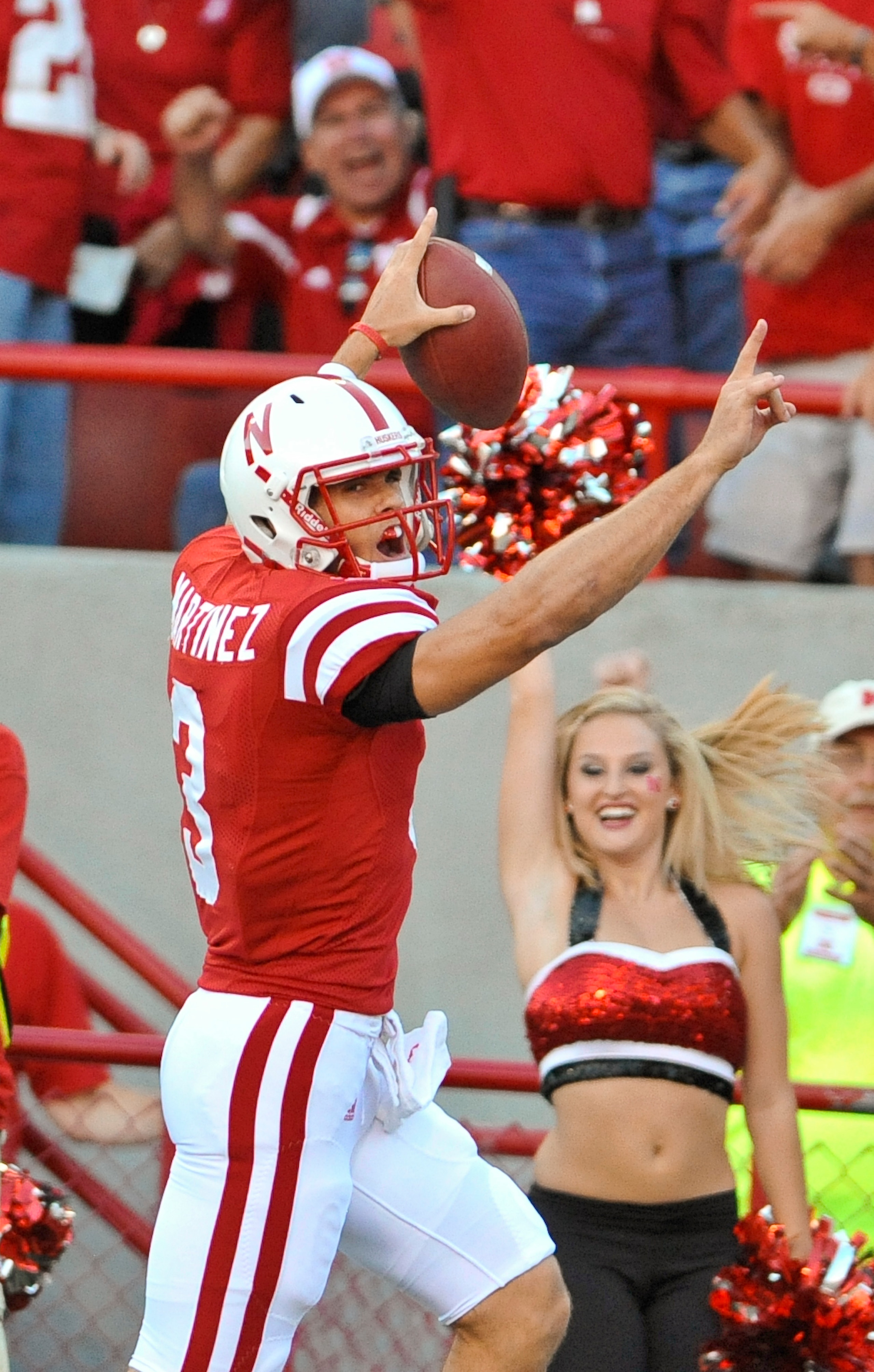 LINCOLN, NE - SEPTEMBER 04:  Taylor Matinez  #3 of the Nebraska Cornhuskers scores his first touchdown as a Cornhusker during the first half of  their game against the Western Kentucky Hilltoppers at Memorial Stadium on September 4, 2010 in Lincoln, Nebra