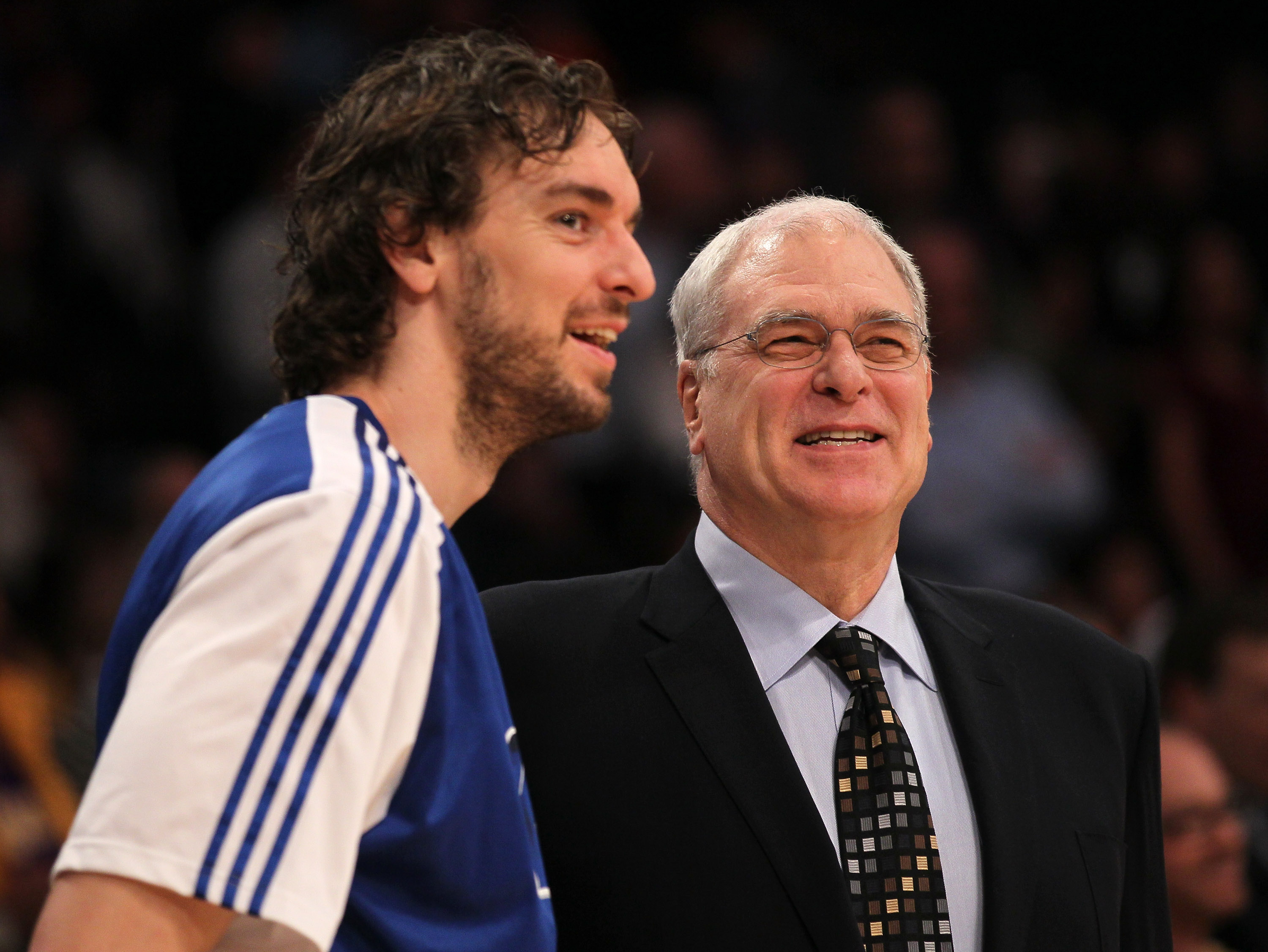 LOS ANGELES, CA - JANUARY 11:   Head coach Phil Jackson and Pau Gasol #16 of the Los Angeles Lakers laugh before the game with the Cleveland Cavaliers at Staples Center on January 11, 2011 in Los Angeles, California.  The Lakers won 112-57.  NOTE TO USER: