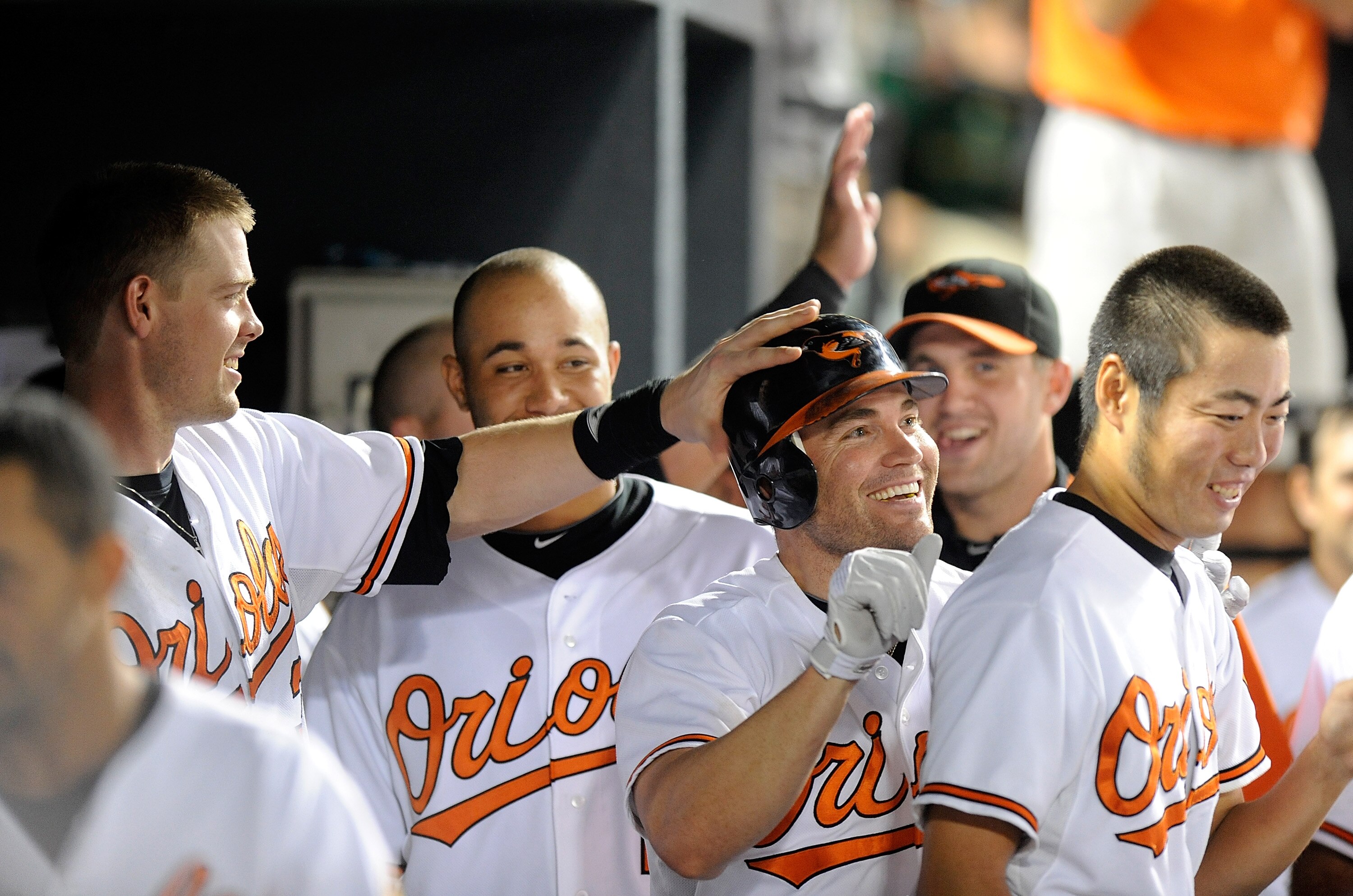 BALTIMORE - AUGUST 31:  Luke Scott #30 of the Baltimore Orioles celebrates with teammate Matt Wieters #32 after hitting a home run in the eighth inning against the Boston Red Sox at Camden Yards on August 31, 2010 in Baltimore, Maryland.  (Photo by Greg F