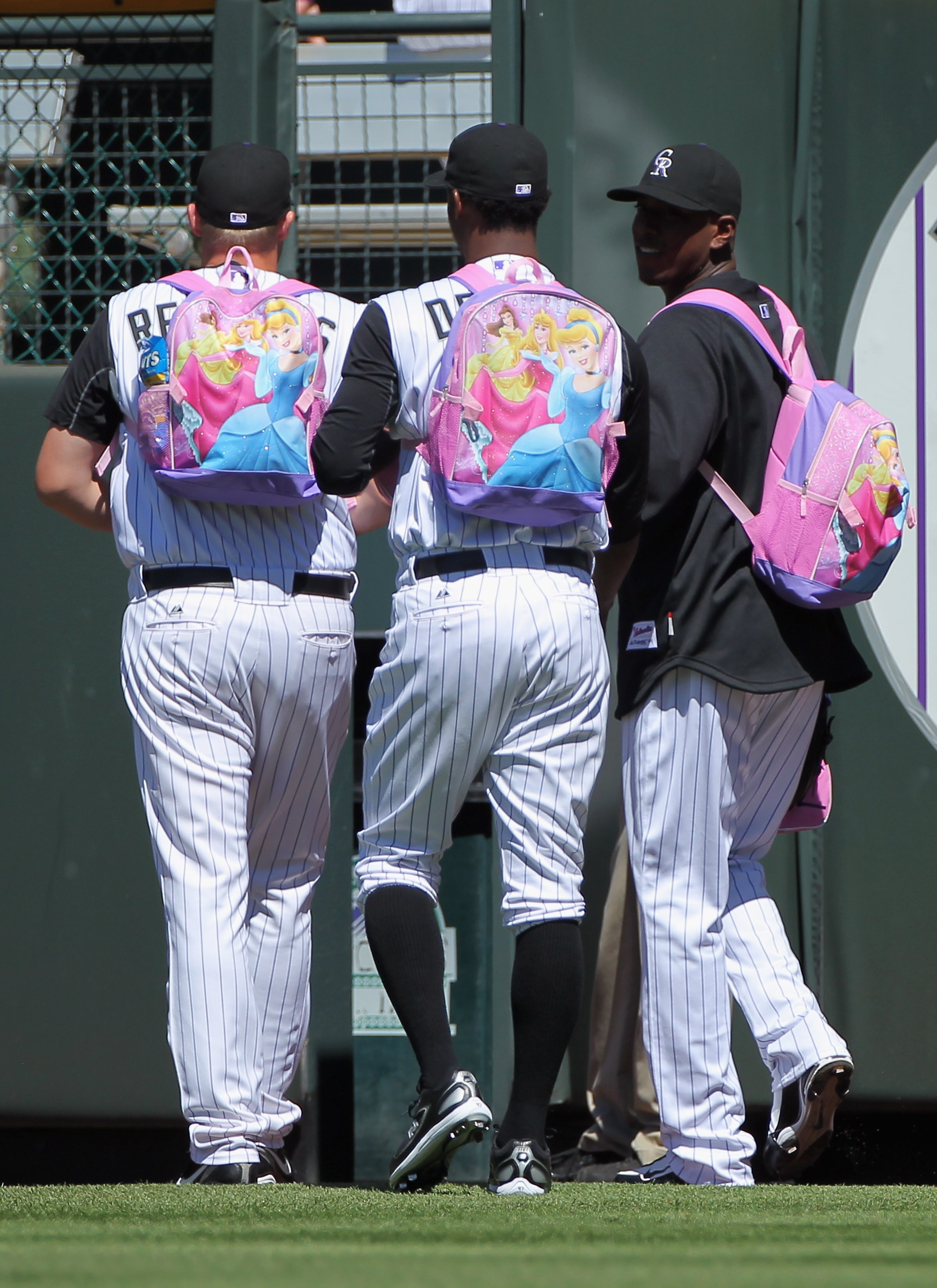 DENVER - SEPTEMBER 09:  Rookie pitchers for the Colorado Rockies head for the bullpen wearing their backpacks to face the Cincinnati Reds at Coors Field on September 9, 2010 in Denver, Colorado. Hammel pitches seven innings as the Rockies defeated the Red