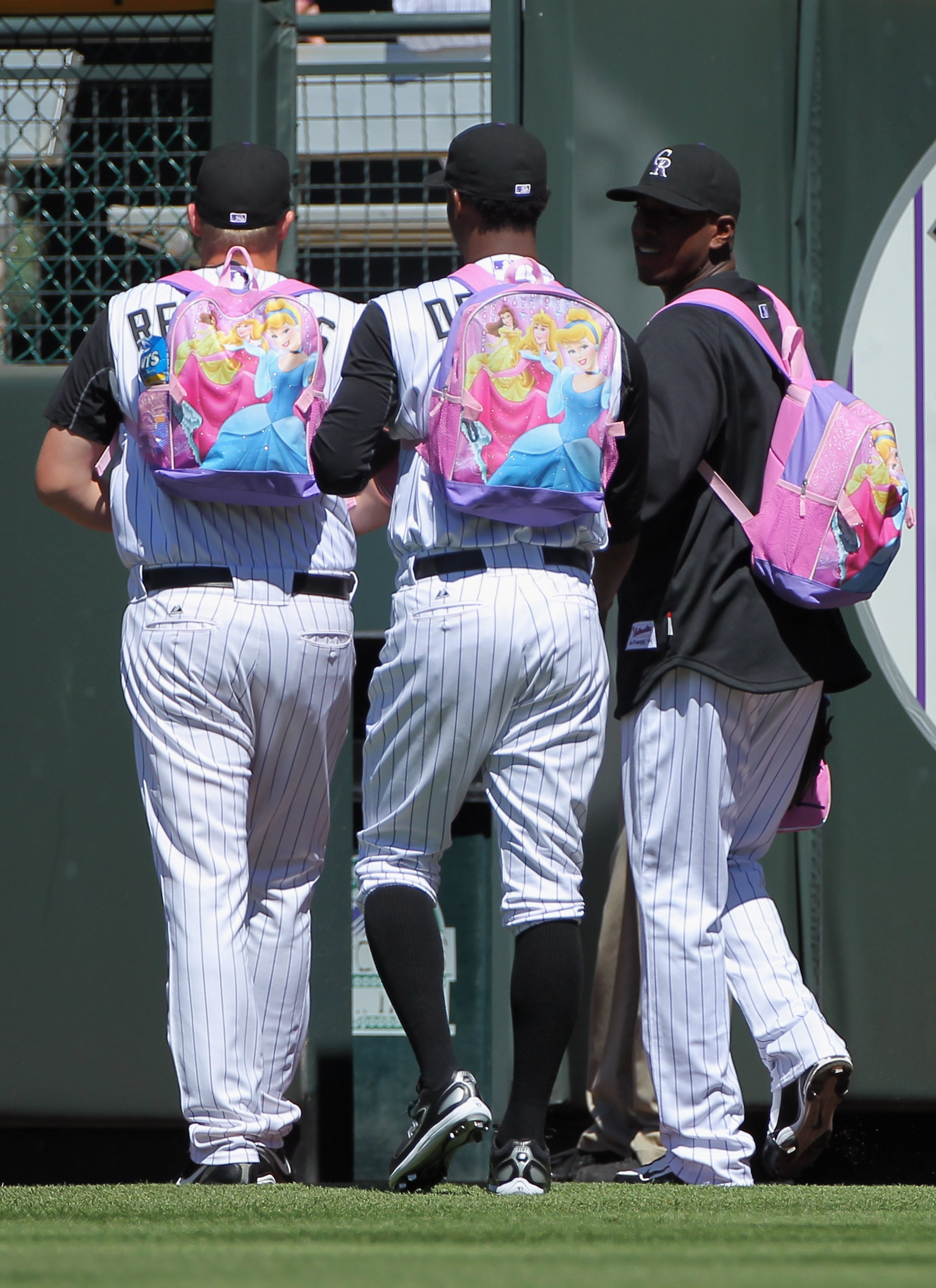 DENVER - SEPTEMBER 09:  Rookie pitchers for the Colorado Rockies head for the bullpen wearing their backpacks to face the Cincinnati Reds at Coors Field on September 9, 2010 in Denver, Colorado. Hammel pitches seven innings as the Rockies defeated the Red