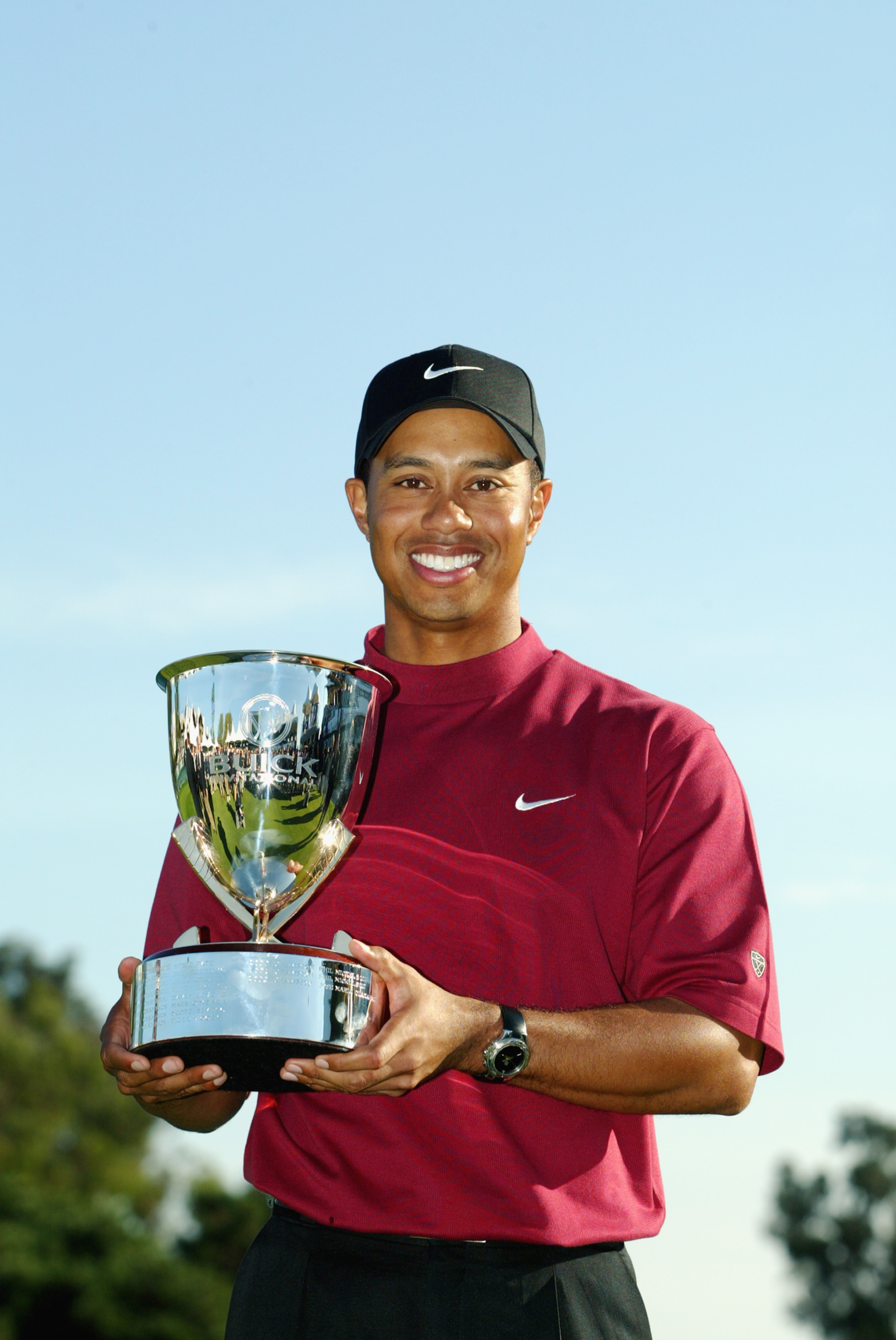SAN DIEGO, CA - FEBRUARY 16: Tiger Woods smiles as he holds the winner trophy after his victory at the Buick Invitational at Torrey Pines Golf Course on February 16, 2003 in La Jolla, California. (Photo by Donald Miralle/Getty Images) SAN DIEGO, CA - FEBRUARY 16: Tiger Woods smiles as he holds the winner trophy after his victory at the Buick Invitational at Torrey Pines Golf Course on February 16, 2003 in La Jolla, California. (Photo by Donald Miralle/Getty Images)