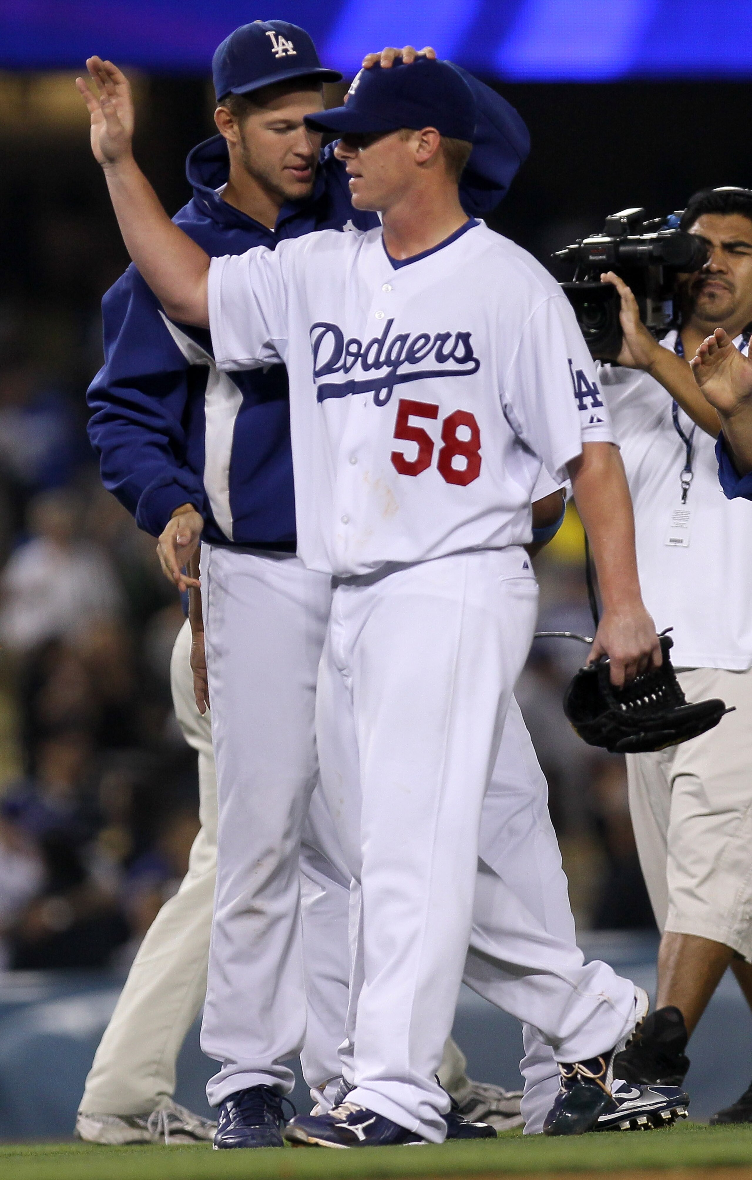 LOS ANGELES, CA - JULY 21:  Pitcher Chad Billingsley #58 of the Los Angeles Dodgers is congratulated by fellow pitcher Clayton Kershaw #22 after his complete game shutout against the San Francisco Giants on July 21, 2010 at Dodger Stadium in Los Angeles,