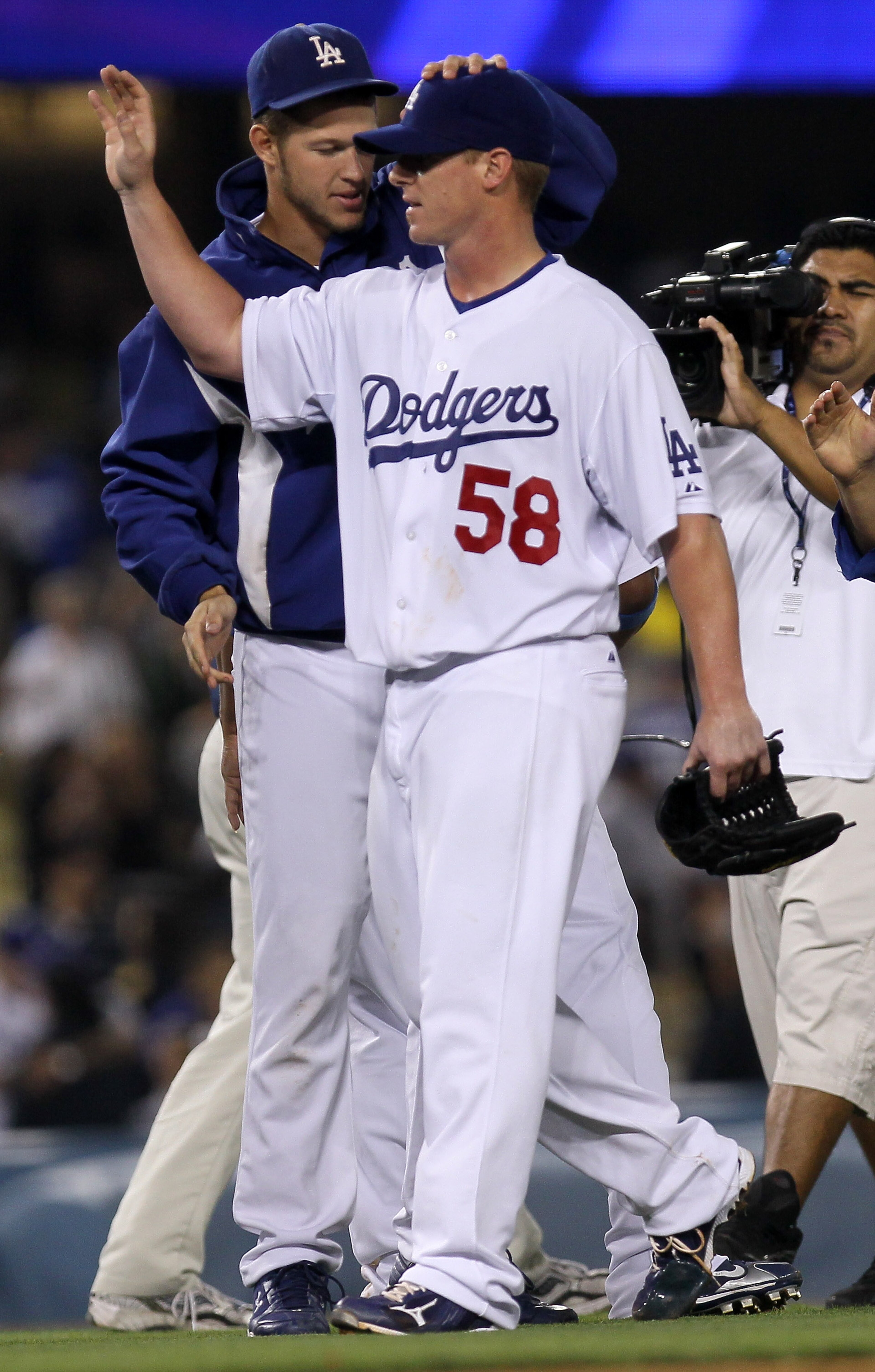 LOS ANGELES, CA - JULY 21:  Pitcher Chad Billingsley #58 of the Los Angeles Dodgers is congratulated by fellow pitcher Clayton Kershaw #22 after his complete game shutout against the San Francisco Giants on July 21, 2010 at Dodger Stadium in Los Angeles,