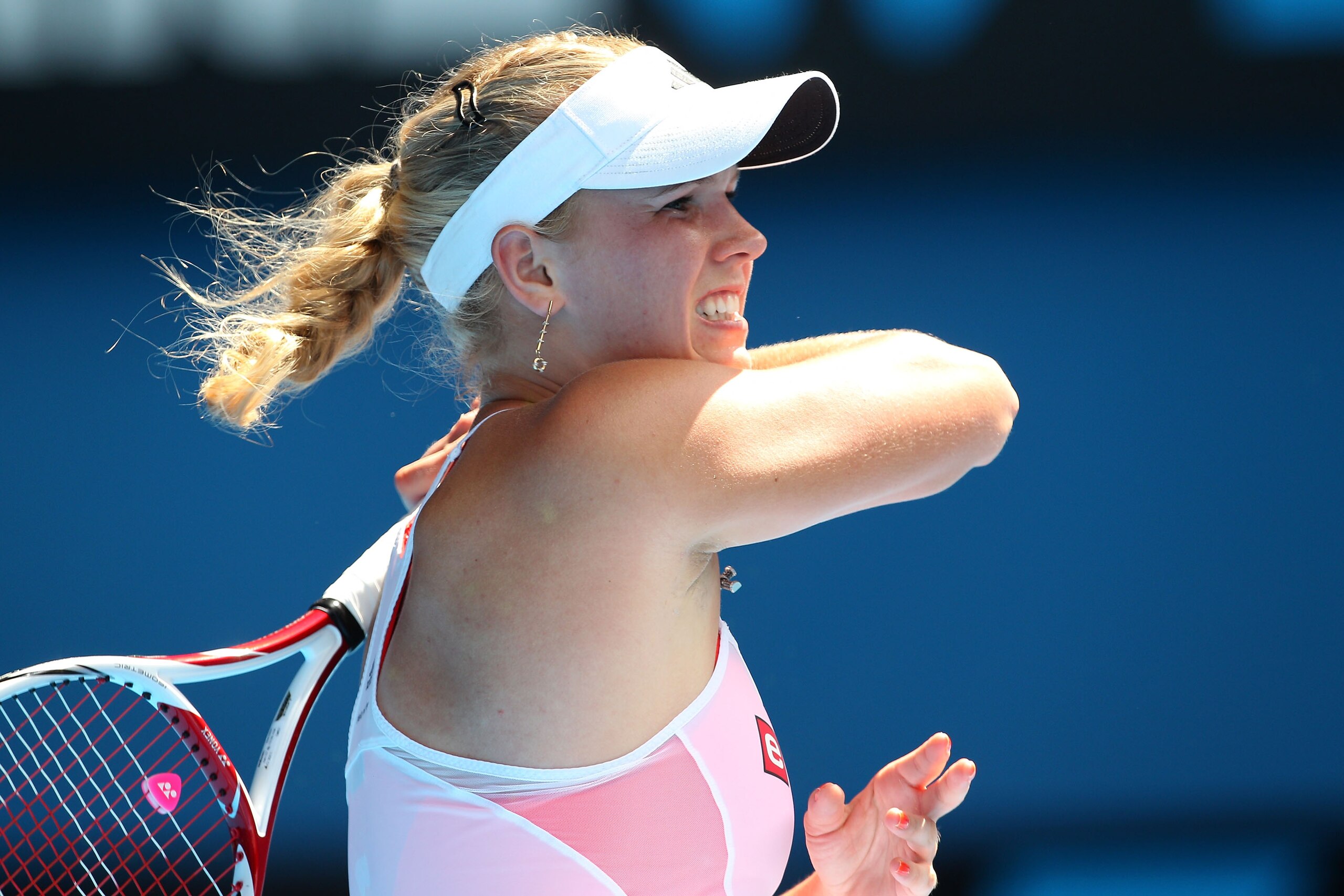 MELBOURNE, AUSTRALIA - JANUARY 27:  Caroline Wozniacki of Denmark plays a forehand in her semifinal match against Na Li of China during day eleven of the 2011 Australian Open at Melbourne Park on January 27, 2011 in Melbourne, Australia.  (Photo by Camero