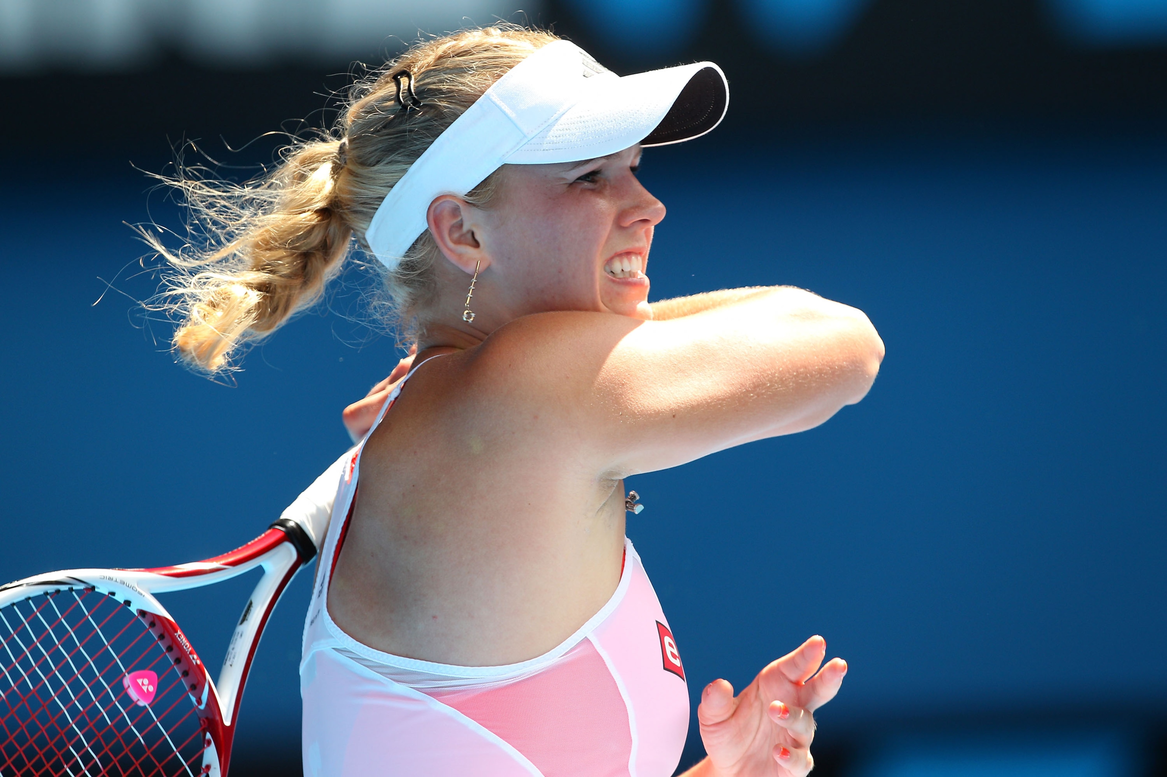 MELBOURNE, AUSTRALIA - JANUARY 27:  Caroline Wozniacki of Denmark plays a forehand in her semifinal match against Na Li of China during day eleven of the 2011 Australian Open at Melbourne Park on January 27, 2011 in Melbourne, Australia.  (Photo by Camero
