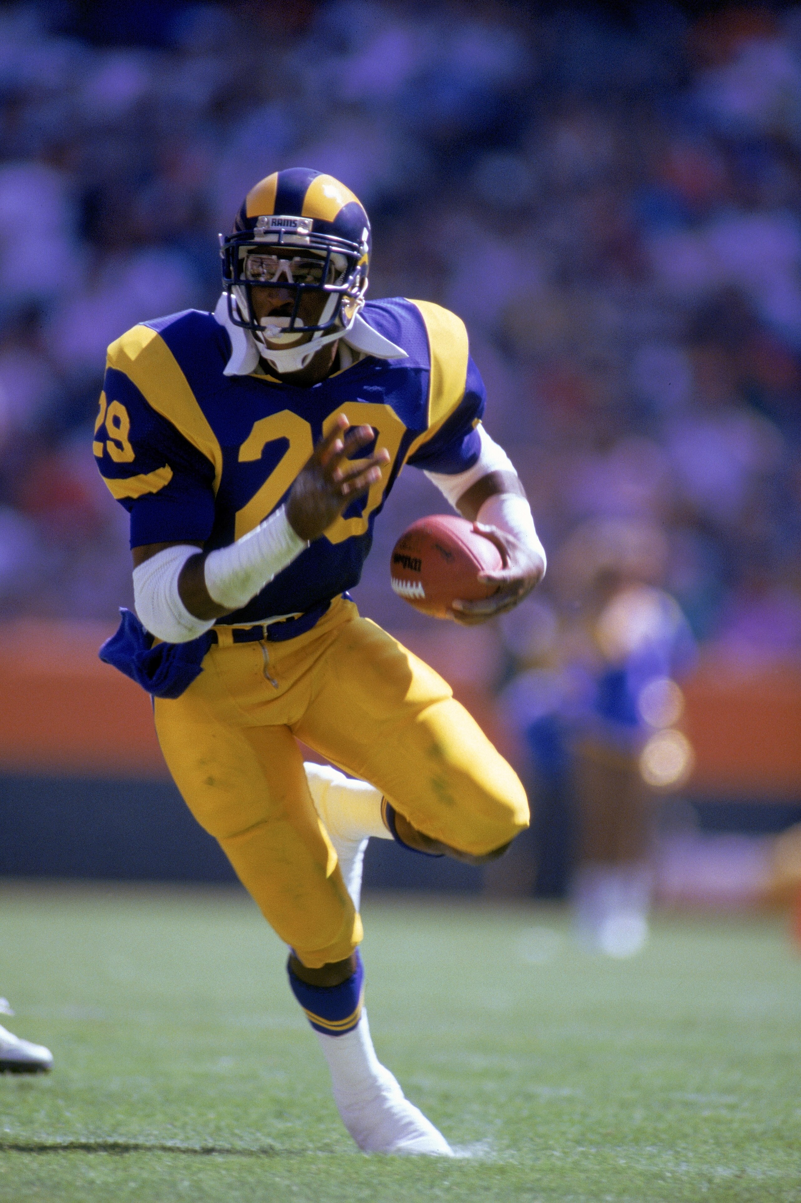 UNDATED:  Eric Dickerson #23 of the Los Angeles Rams runs with the ball during a game.  Eric Dickerson played for the Los Angeles Rams from 1983-1987. (Photo by Mick Powell/Getty Images)