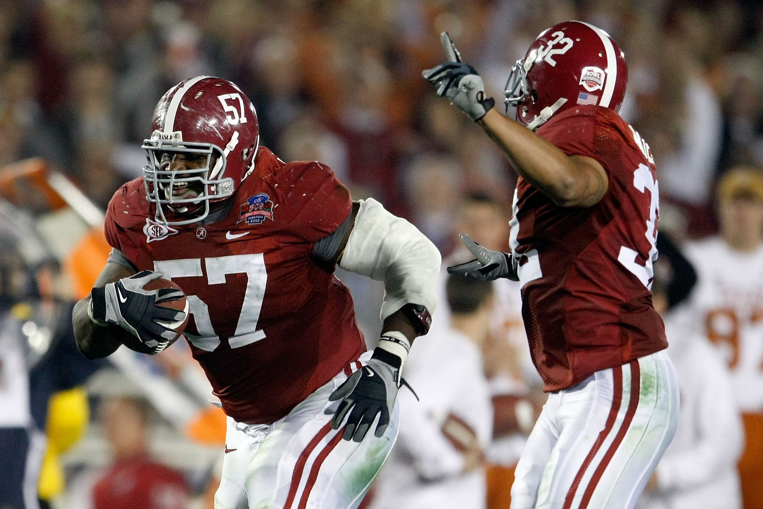 PASADENA, CA - JANUARY 07:  Lineman Marcell Dareus #57 of the Alabama Crimson Tide runs with the ball after an interception against the Texas Longhorns during the second quarter of the Citi BCS National Championship game at the Rose Bowl on January 7, 201