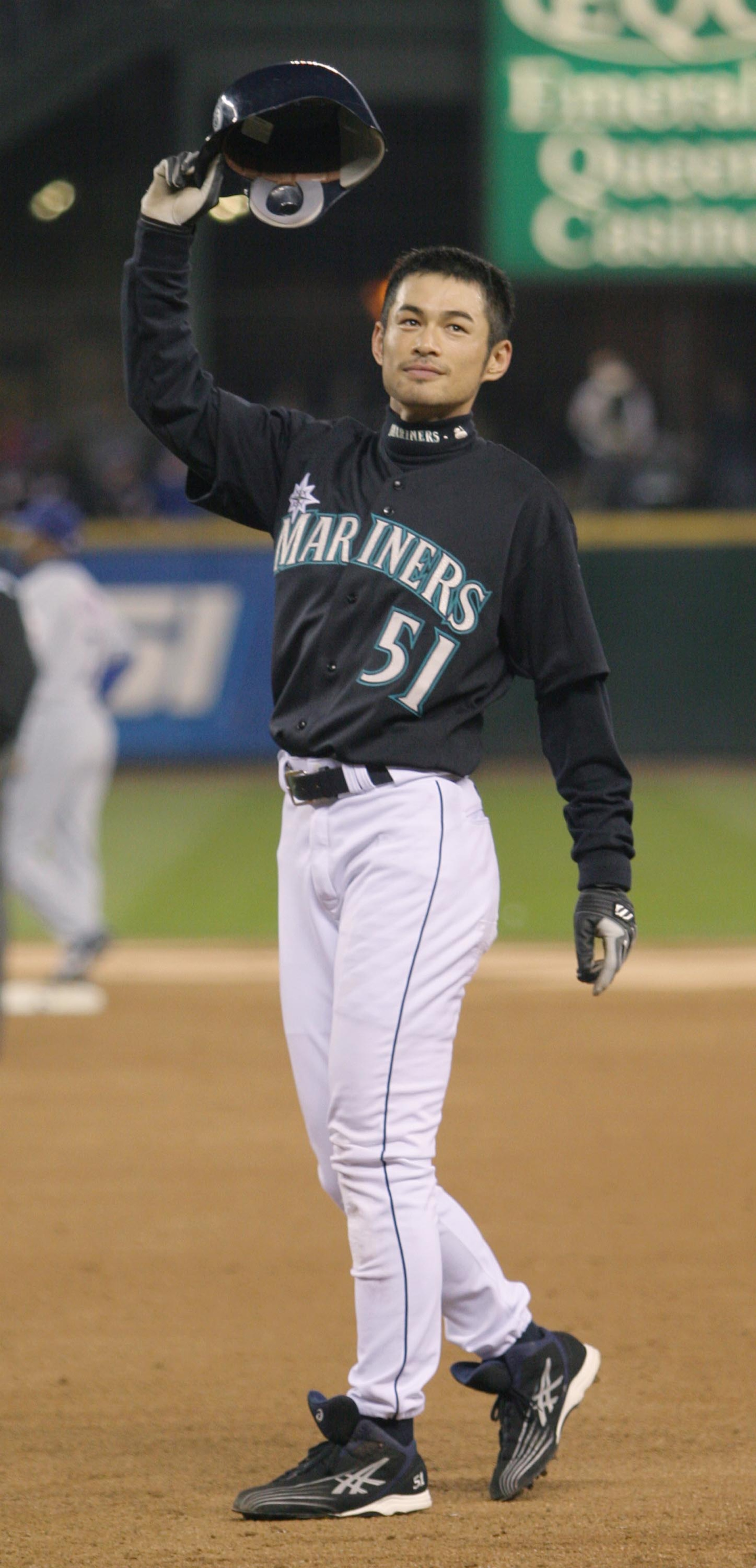 SEATTLE - OCTOBER 1:  Ichiro Suzuki #51 of the Seattle Mariners waves to the crowd after singling to center field against the Texas Rangers in the third inning on October 1, 2004 at Safeco Field in Seattle, Washington.  This was Suzuki's 258th hit of the