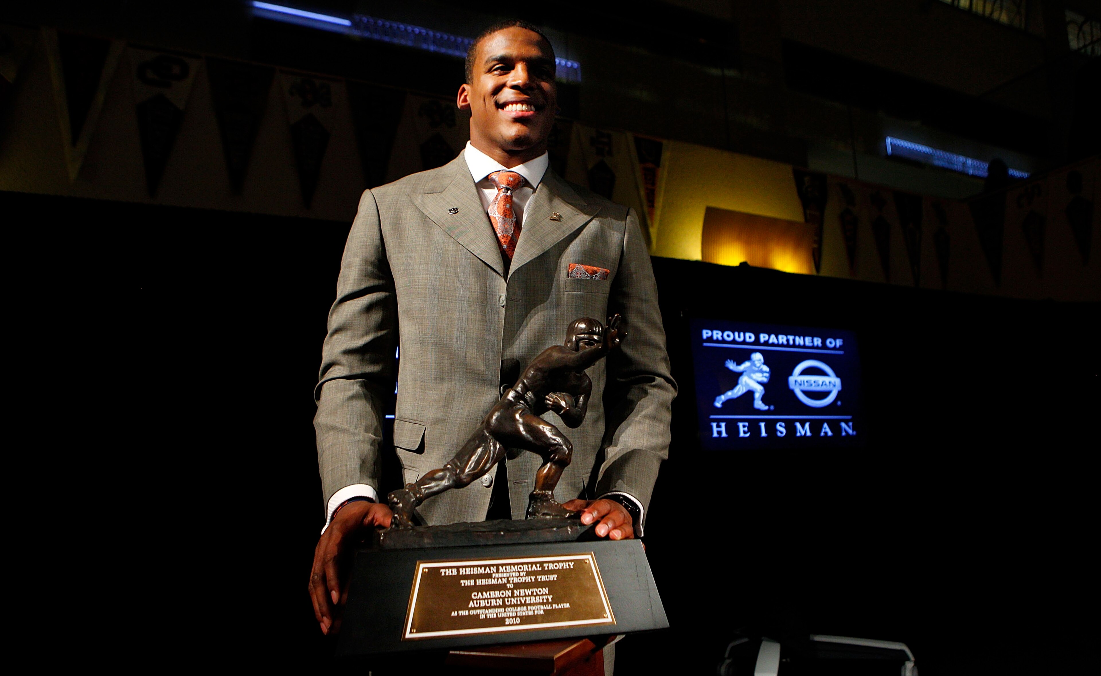 NEW YORK - DECEMBER 11: Cam Newton, quarterback of the Auburn University Tigers, poses with the 2010 Heisman Memorial Trophy Award on December 11, 2010 in New York City. (Photo by Jeff Zelevansky/Getty Images) NEW YORK - DECEMBER 11: Cam Newton, quarterback of the Auburn University Tigers, poses with the 2010 Heisman Memorial Trophy Award on December 11, 2010 in New York City. (Photo by Jeff Zelevansky/Getty Images)