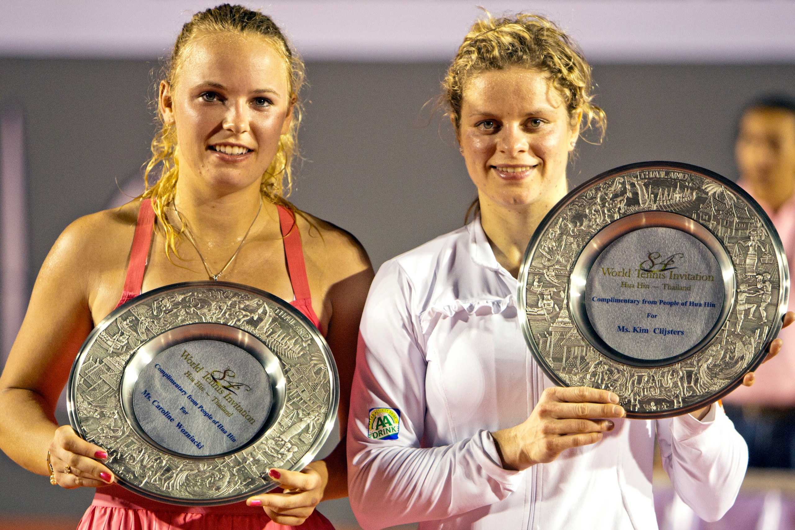 HUA HIN, THAILAND - JANUARY 01:    Caroline Wozniacki of Denmark and Kim Clijsters of Belgium hold the trophy after their exhibition match at Centenial Park on January 1, 2011 in Hua Hin, Thailand.  (Photo by Athit Perawongmetha/Getty Images)