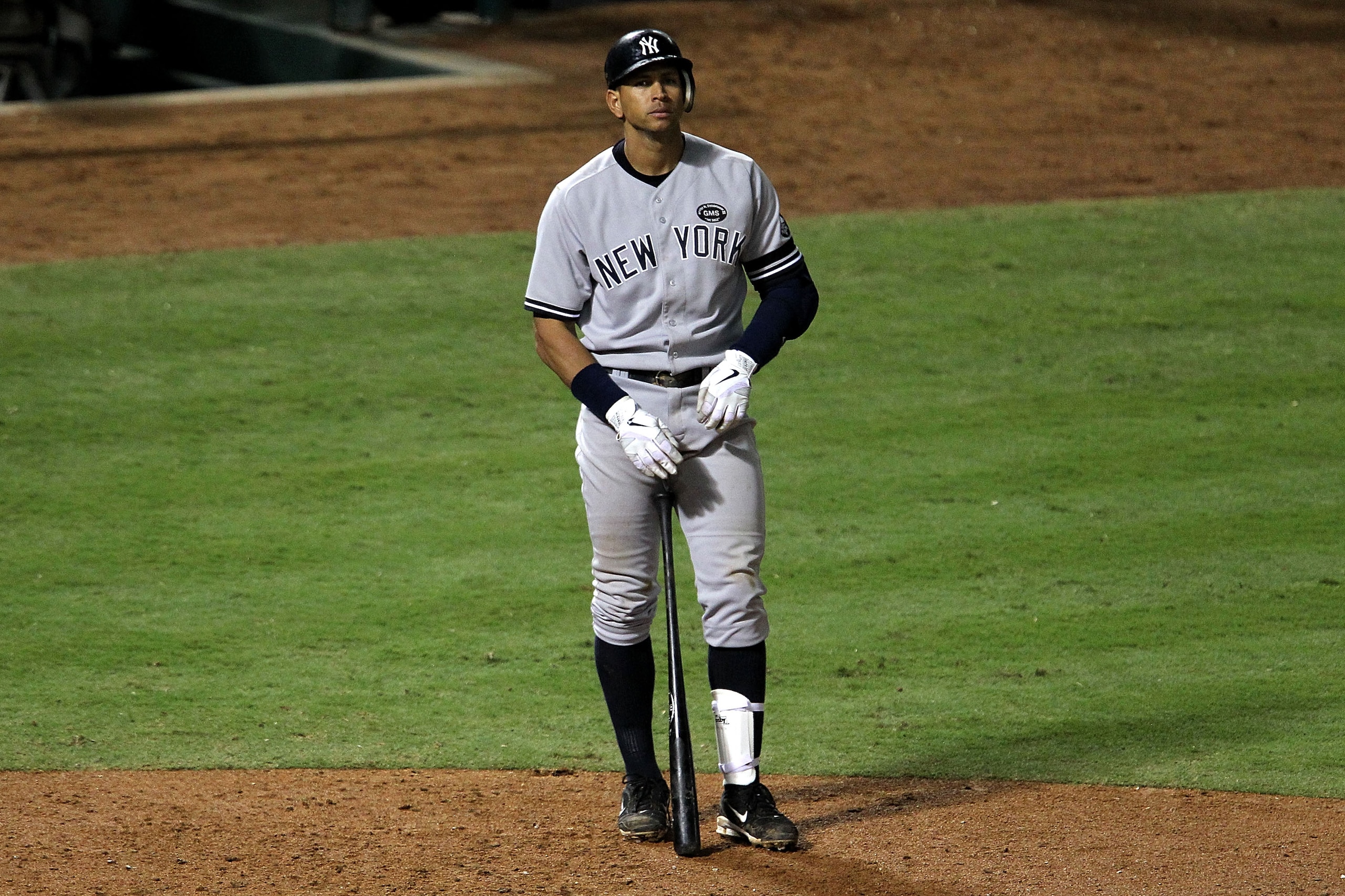 ARLINGTON, TX - OCTOBER 22:  Alex Rodriguez #13 of the New York Yankees stands outside the batters box during the ninth inning of Game Six of the ALCS against the Texas Rangers during the 2010 MLB Playoffs at Rangers Ballpark in Arlington on October 22, 2