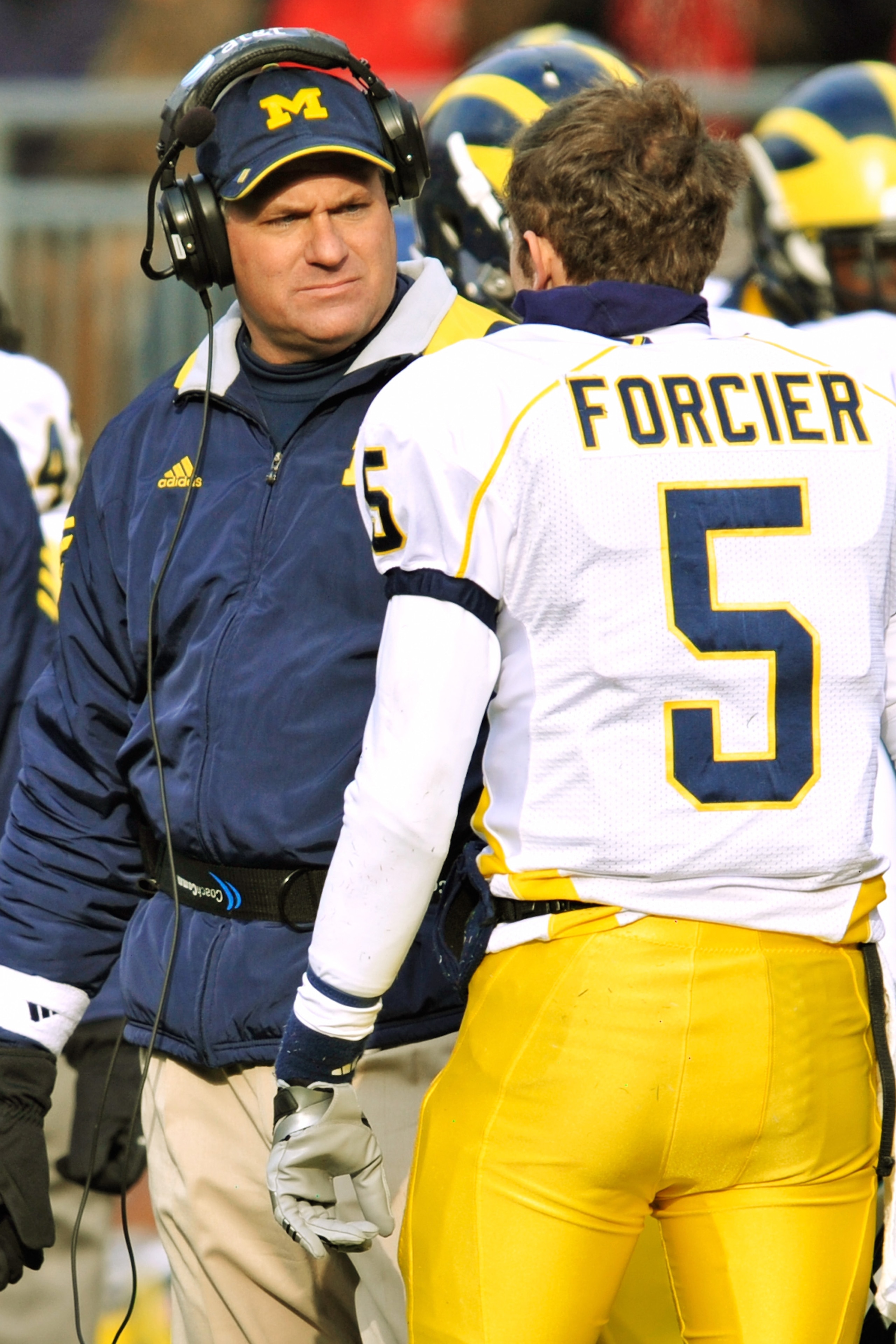 COLUMBUS, OH - NOVEMBER 27:  Head Coach Rich Rodriguez of the Michigan Wolverines talks to quarterback Tate Forcier #5 of the Michigan Wolverines during a game against Ohio State Buckeyes at Ohio Stadium on November 27, 2010 in Columbus, Ohio.  (Photo by